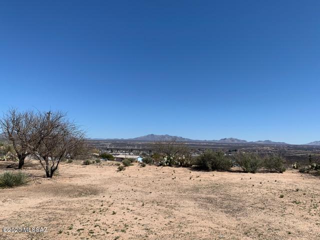 1.3 acre parcel in town,  tucked back off the  paved road. Wonderful views of the Dragoon Mtns and west slope of Cochise Stronghold. You will have awesome  sunrises and moon rises. No HOA. Owned by the same family for years,  one of the last great lots in town to build on.  All utilities are at the road.