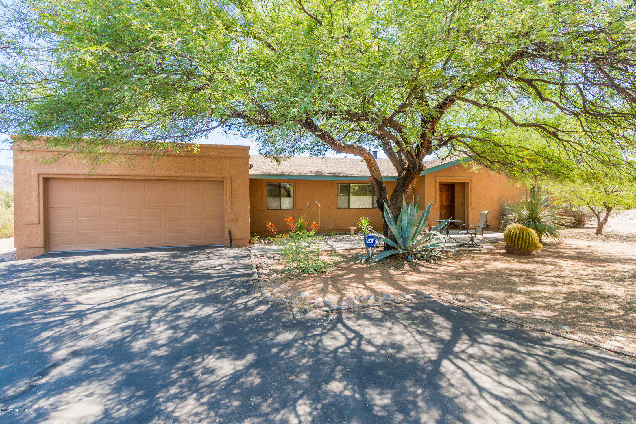Wonderful east facing mountain views from this awesome home on a beautiful private 1.48 parcel of land. The private driveway welcomes you home and the old beautiful mesquite tree at the entrance offers nice shade. No horse facilities but horses are allowed. Open floor plan with high ceilings, cozy fireplace in the family room and an eat in kitchen with views of the mountains. Granite counters in the kitchen, stainless appliances. All appliances convey. Beautiful floors throught, no carpet! The covered patio is a delightful place to enjoy your backyard with the pool and spa. Enjoy nature as you relax and watch those gorgeous Catalina mountains turn pink. Lovely sellers who love their home but a job transfer is calling them in a new direction.