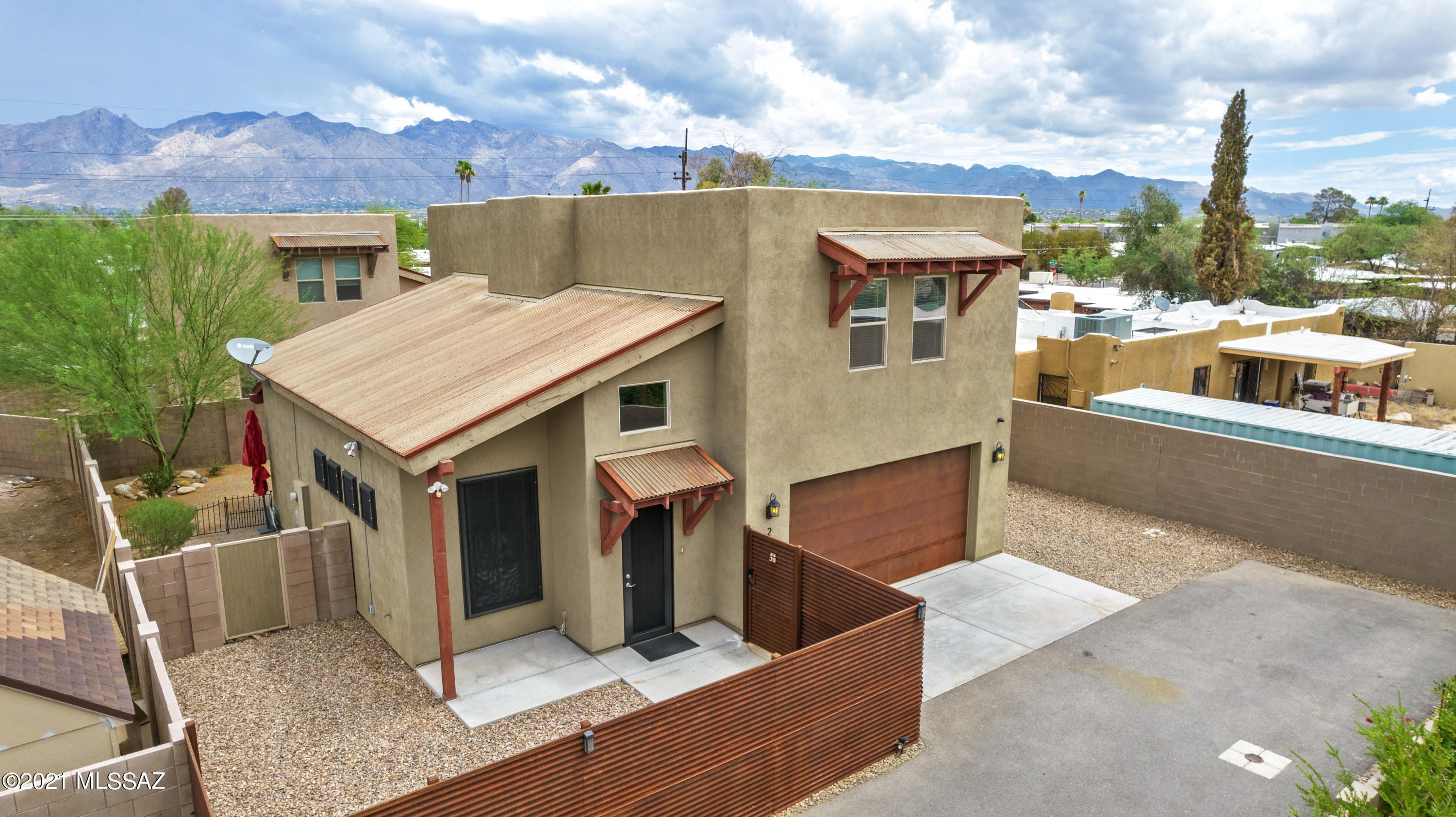 Centrally located gem, home built 2016, offers plenty of space, 3bd, a den and 2 1/2 ba, with intimate & private yards .  The fencing, garage door and part of the roof are patina corrugated metal.   The home is consistent with granite counter tops in the  kitchen and bathrooms. Enjoy the abundant storage throughout the home and endless cabinets and extra storage closet in the garage.  Perfect for travelers, this home features security screens at downstairs windows, front door and slider. Seller installed security camera's at the front and back of the house as well security system is in place. No HOA.  This home is ready for your personal details, move in, live easy and enjoy.