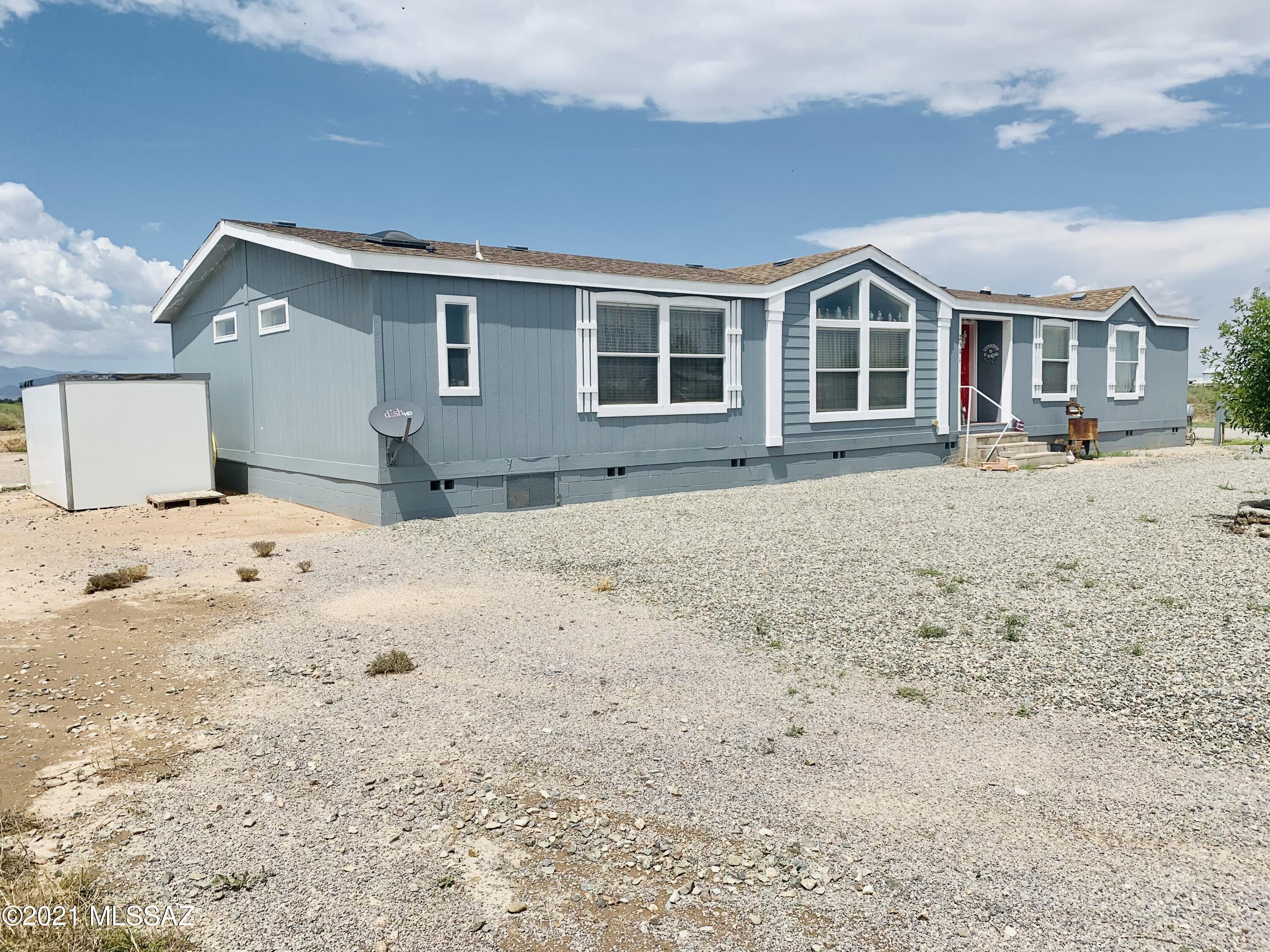 Three Bedroom, Two Bath Spacious Affixed Manufactured home with Back Patio, Open Kitchen, With Island, Family Room, Dinning area, Mud Room/Laundry Room, walk in closents in every room, Fenced back yard on one acre, HORSE PROPERTY.