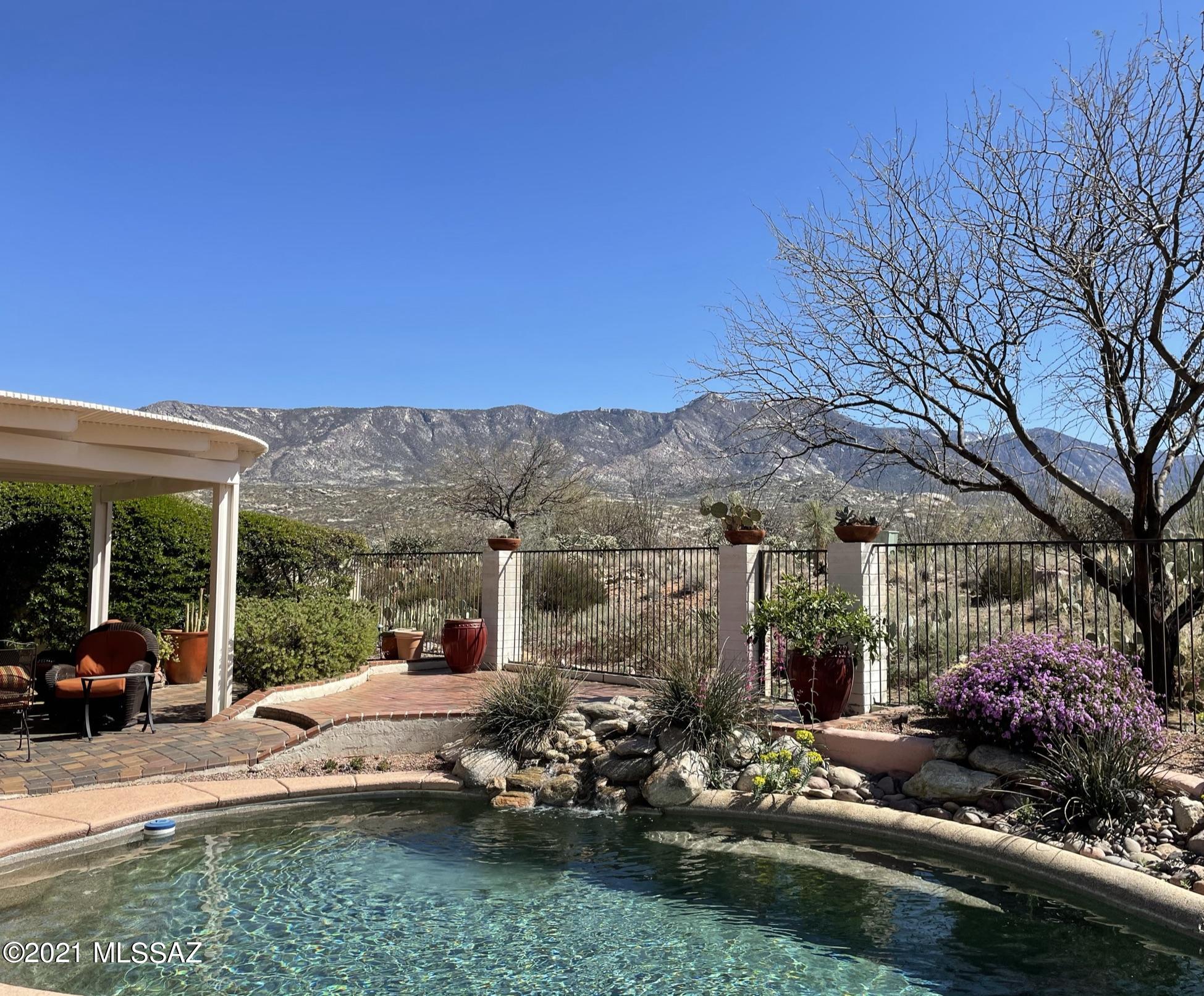 Highly sought after location rarely avaiable! One of Saddlebrooke's most private lots with SWEEPING MOUNTAIN VIEWS. Elegantly appointed home with sepreate guest house, 3-bedroom 3 bath Barcelona sits on the edge of open space with spectacluar, south-facing views! Home boasts 2-sided fireplace to living & dining rooms. Den with beautiful built-ins. maple cabinets, granite and SS appliances in updated kitchen. Bright Owner's suite w/slider door to patio & window views of the pool and mtns; jetted tub, large shower & walk in closet. Remote control Hunter blinds & 20'' tile! Enjoy the covered patio with sounds of pool waterfall & desert landscape. Extended 2.5 car garage with utility sink and plenty of storage. Turnkey w/furnishings, seperate bill of sale-MOVE IN READY!