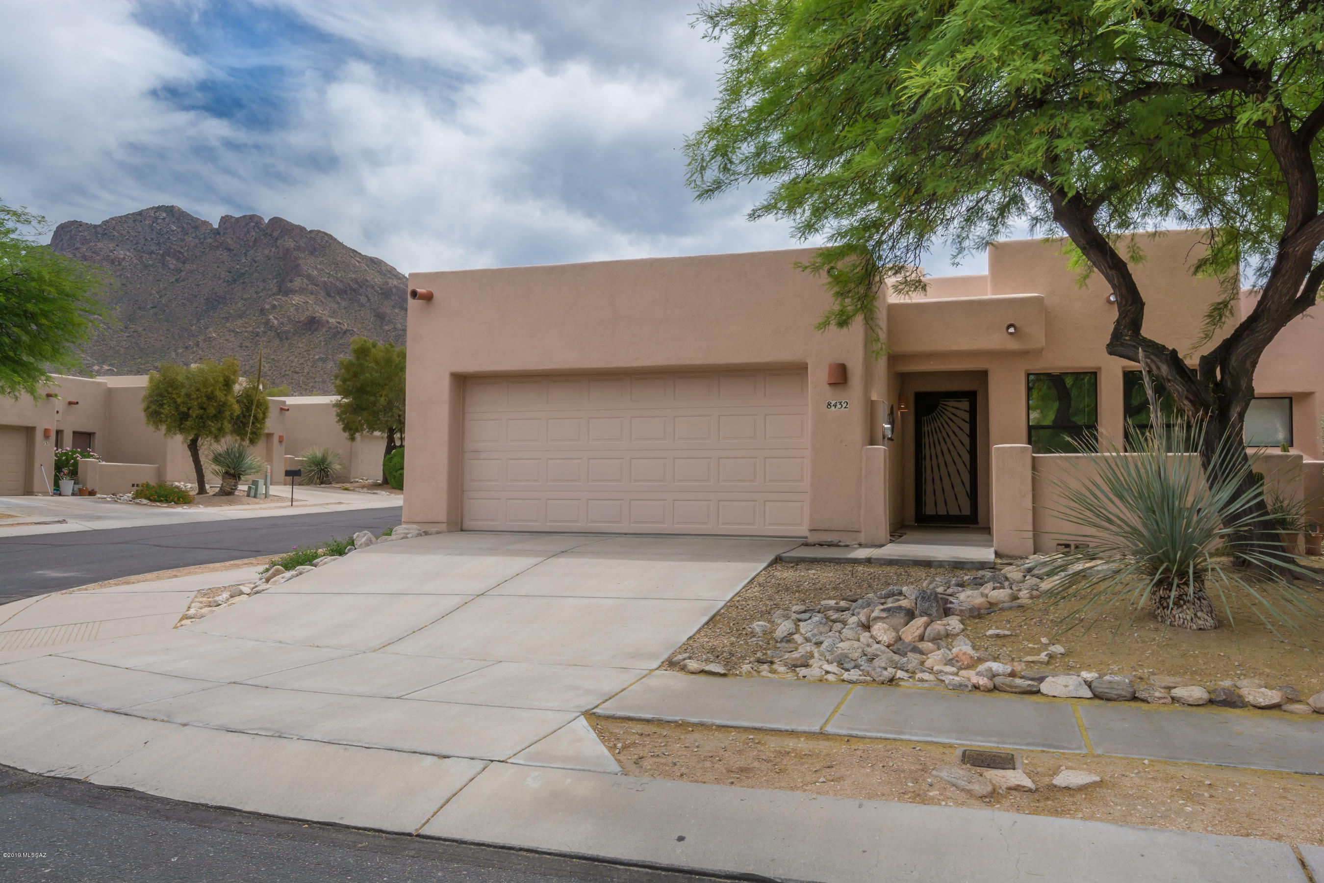 Run, don't walk to this very nicely updated townhome on a corner lot with lovely mountain views and located in sought after Oro Valley.  Designed by Rob Robinette, this home boasts gorgeous ceramic tile floors, stunning stacked stone fireplace, granite counters, designer tile backsplash, newer appliances, clerestory windows and high vaulted ceilings.  Bathrooms feature granite as well, newer sinks and light fixtures and AC/Heat all replaced in 2015.   Large block walled in backyard with covered patio.   Be sure not to miss the fabulous community pool with picnic area at the end of the cul-de-sac.