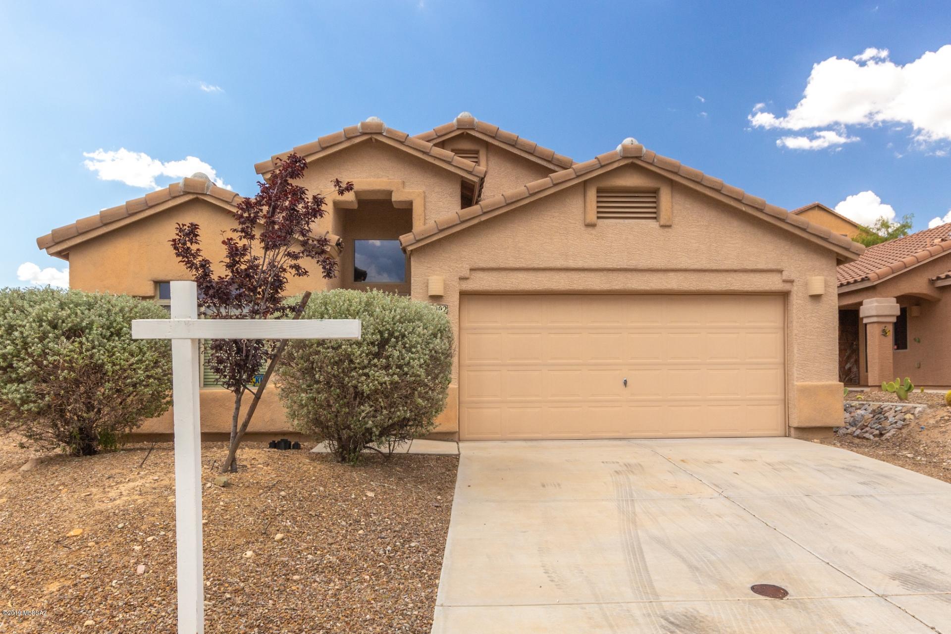 Lovely 4 bedrooms, 2 bath single-story home with 1,700+ sqft of living space in north Tucson. Enjoy New plush carpets,New wood-look flooring, laundry with built-in cabinets, large front living room, vaulted ceilings, New Interior paint, plant shelving, and large picture windows for lots of natural light. The open kitchen includes warm staggered cabinetry, New SS appliances, built-in microwave, and island with built-in cabinets for extra storage and prep space. The tranquil master features immaculate private ensuite with glass enclosed walk-in shower, double sinks, and walk-in closet. The ample backyard is a great canvas to make your landscaping dreams come true! Schedule a showing for this charmer today!