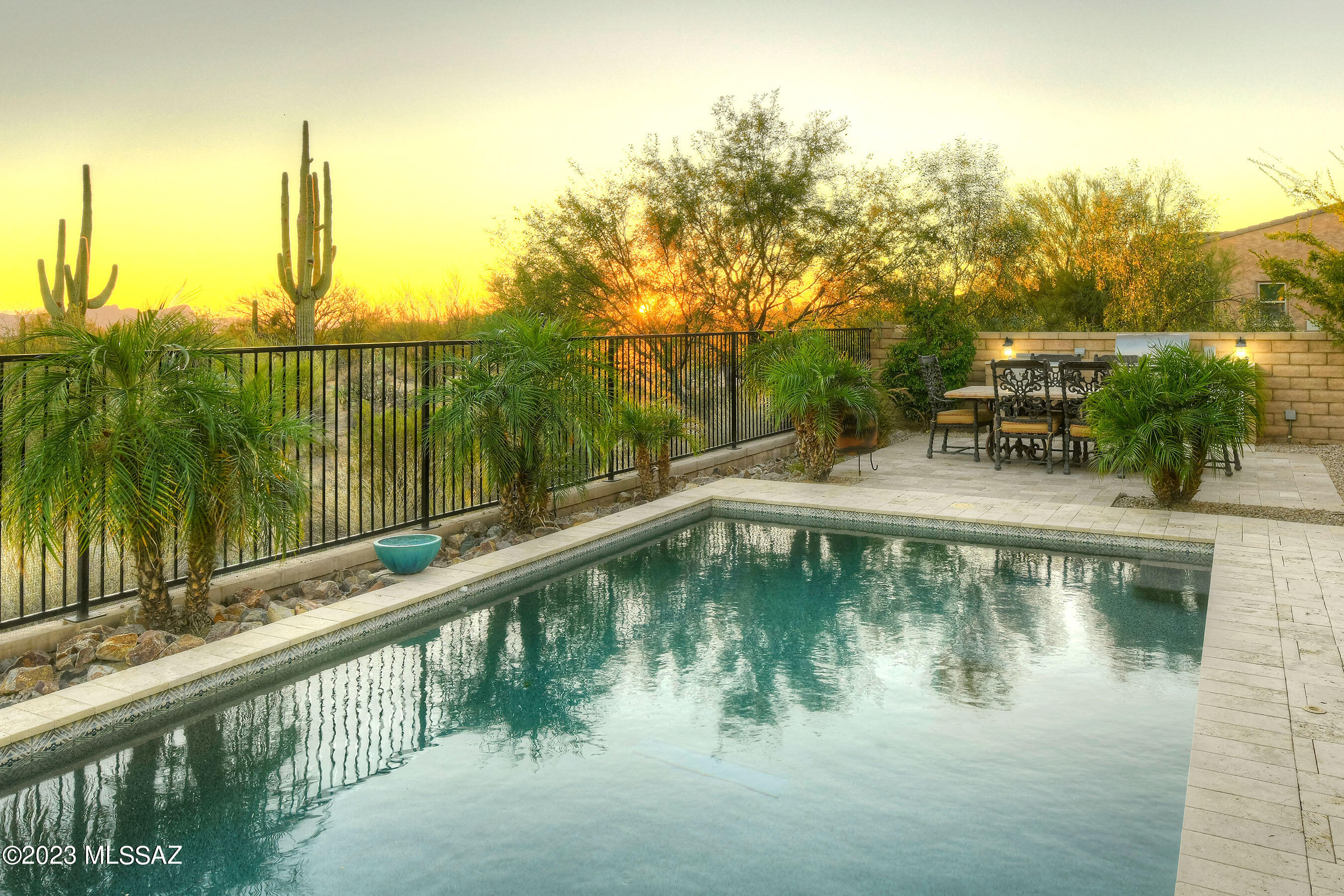* DESERT JEWEL* CHARMING ESTATE NESTLED ON .75 ACRE PREM LOT- BORDERS DESERT W/INCREDIBLE CITY & SUNSET VIEWS! AMAZING FLRPLAN OFFERS ROOM FOR EVERY LIFESTYLE... *BONUS RMS* -2 OFFICES W/BUILT INS, + WONDERFUL REC/MEDIA ROOM BOASTS DRY BAR & BEV CENTER PERFECT FOR MOVIE NIGHT! HUGE GATHERING ROOM IS ''HUB OF THIS HOME''- OPENS TO CASUAL DINING, OVERSIZED ISLAND, CENTER OPENING SLILDERS TO RESORT BKYD! HEATED POOL, GORGEOUS TRAVETINE PAVERS, NEW BBQ/ALFRESCO KIT WITH GRIDDLE, EASY CARE TURF & VIEW FENCING TO ENJOY SPECTACULAR MTN, CITY & SUNSET VIEWS! LOADED W/UPGRADES, NEW PLANK TILE FLOORS, TV'S & COMPONENTS INCL, SEP GUEST WINGS, ''4 CAR'' GARAGES ( SPLIT 2+2), FRESHLY PAINTED 2/TONE, NATURAL STONE GAS FP, & MORE! GATED COMMUNITY *FURNISHINGS AVAILABLE FOR SALE* POSSIBLE TURN KEY READY*