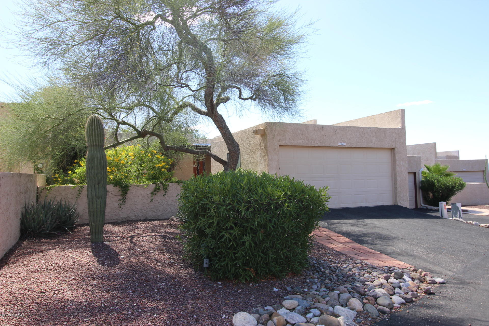 Amazing lifestyle and views await you in this lovely townhome high in the Catalina Foothills.  Gaze at the Catalina Mountains from your private gated front courtyard, or the panoramic city lights and sunset from the back porch. This 3 bedroom, 2 bath has a nice master suite with 2 closets, 2 car garage, and includes the washer and dryer.  Trash is included with rent, community pool located just up the street. Contact JC to schedule a showing today.