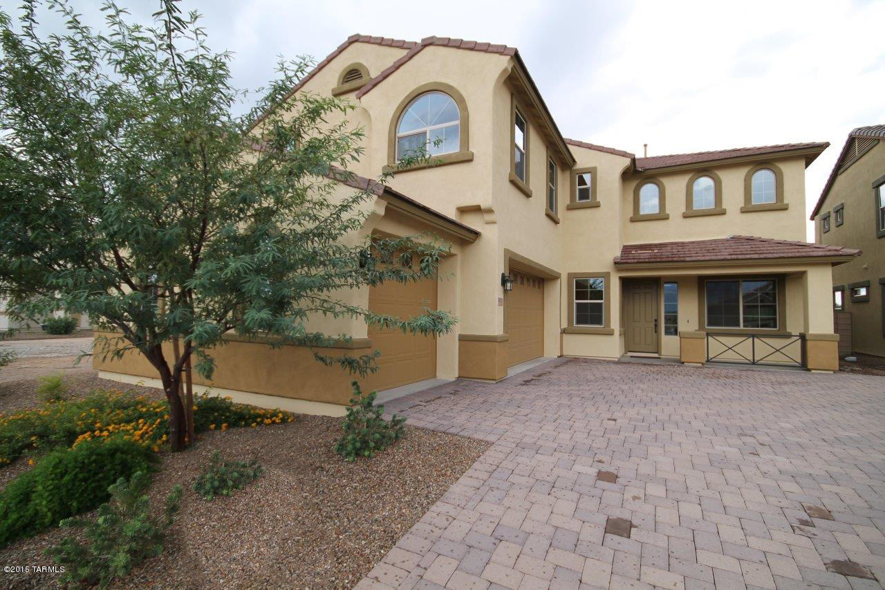 Your new home awaits you! Located within the guarded gates of the prestigious Omni Tucson National Resort!  Part of a small picturesque community  This breathtaking floorplan has been designed to be one of our most open and inviting plans. You'll enjoy the warm and high end finishes, the upgraded cabinetry, the amazing custom tile work... Soaring ceilings and stunning staircase.... Take advantage of the HUGE incentives this home has received. Come visit this home today. Come live ''the life''!