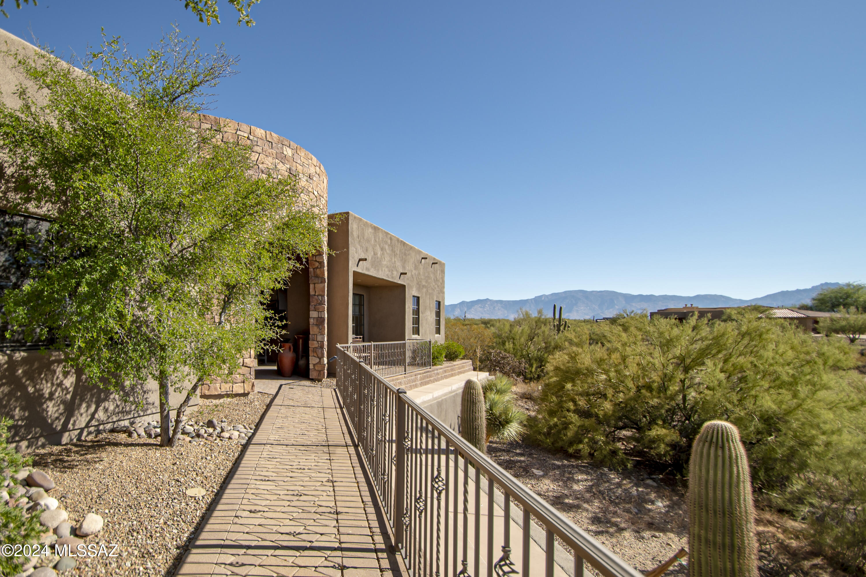 Discover Your Dream Home:
Welcome to this stunning custom-built oasis, offering 4 bedrooms and 4 bathrooms, complete with a peaceful casita/studio that has private access—perfect for guests or as a dedicated home office. Situated on approximately 3.1 acres, this property boasts breathtaking panoramic views of the city skyline and surrounding mountains.
Unmatched Privacy and Luxury:
Nestled beside a natural desert wash, this home provides a sense of serenity and privacy while keeping you just minutes from local amenities. Step inside to find elegant natural stone accents, a dedicated home theater, and a flexible space ready to be transformed into a wine cellar. Read more... In more section Sophisticated Interiors:
The residence spans an impressive 4,734 sq. ft., featuring stone flooring, two cozy fireplaces, and high-end touches throughout. The chef's kitchen is an entertainer's delight, equipped with premium stainless steel appliances and striking countertops.

Outdoor Oasis:
Step outside to your own private retreat, where a sparkling pool, relaxing spa, and a fully outfitted outdoor kitchen awaitperfect for sunny afternoons and starlit gatherings. An elegant paver driveway adds stunning curb appeal as it leads you home.

Optional Furnishings Available:
Select furniture pieces are available for purchase, offering a seamless transition into your luxurious new sanctuary.

Don't miss the chance to call this exquisite property yours. Embrace a life of comfort, beauty, and tranquility. Schedule a private tour today!