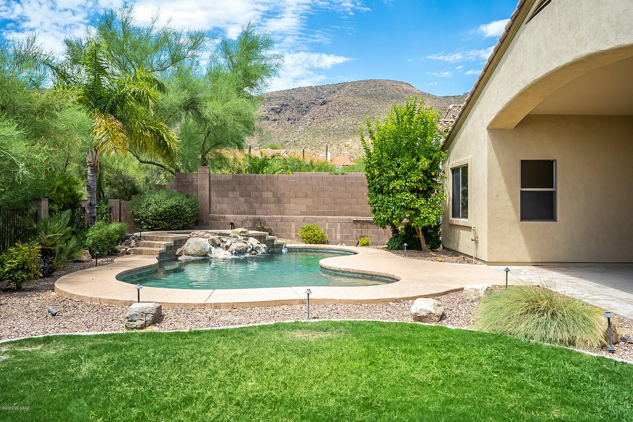Spacious and well-maintained home in Sabino Springs, a gated Golf Community.  Resort- like and private backyard with Pebble Tec pool, spa, lush landscaping and mountain view!  Tall ceilings and natural light welcome you as you walk into the large living room with a lovely view of the pool.  A split floorplan, the master suite and office are in one wing and the two other bedrooms in another. Like a large kitchen?  There is an abundance of cabinet storage and counterspace.  The adjacent family room has a cozy gas fireplace.  The exterior was painted in 2017 and a new pool filter was recently installed.  The private backyard backs to a wash which adds to the resort-like ambiance.  Wired for surround sound - perfect for entertaining!  An added bonus is the 3-car garage with room for a work bench and storage!  Clubhouse, fitness center and community pool and spa.