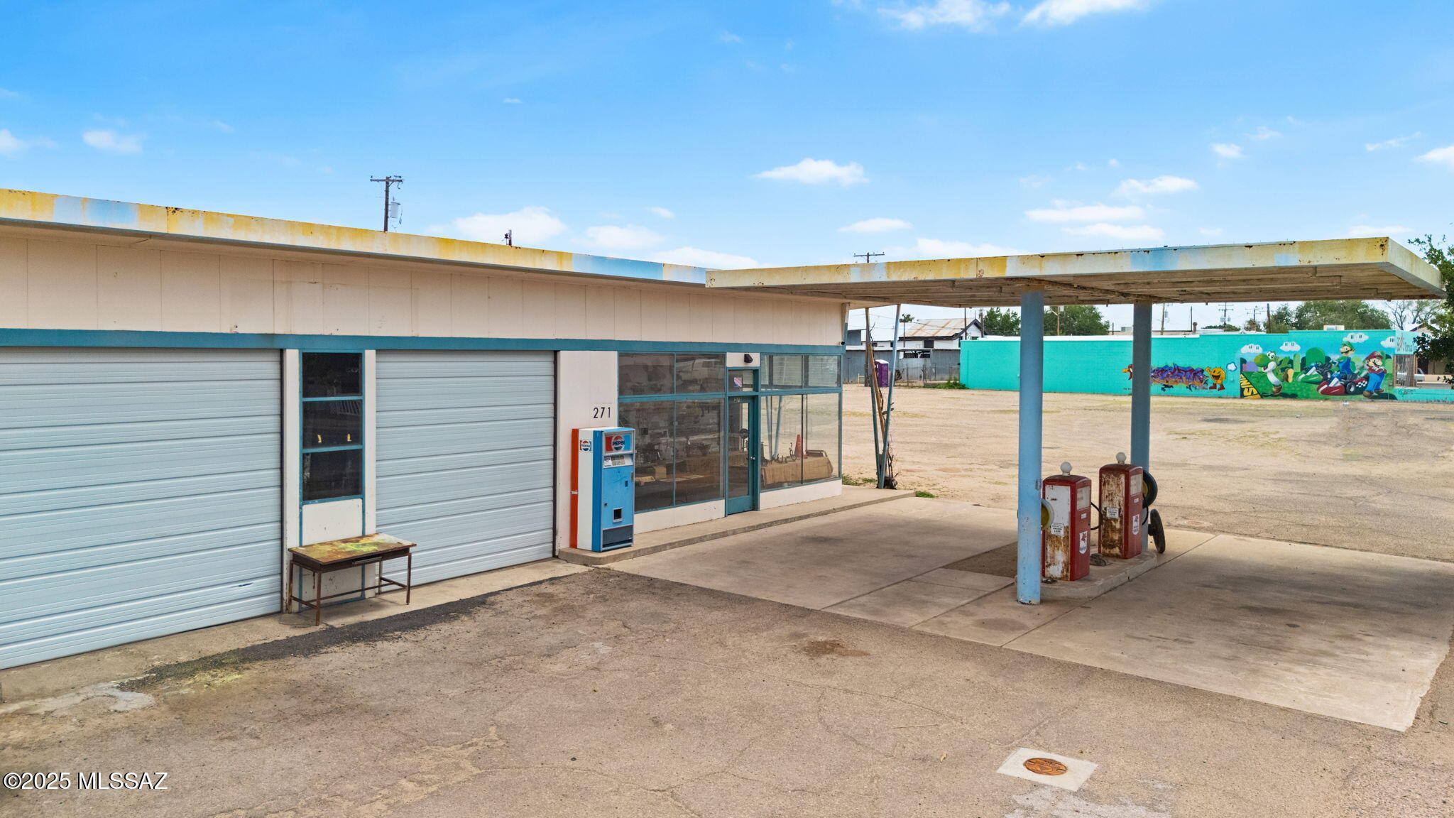 This is your chance to own a piece of history with this unique 2,621 sq ft 1950's Shell gas station, featuring a fully remodeled 650 sq ft single-family residence where you can live comfortably. The home boasts a new metal roof, updated plumbing and electrical, new windows, flooring, washer and dryer hookups, and HVAC. Situated on a double lot and zoned General Commercial, the property allows for a wide range of uses including gas service station, convenience market, retail store, and many other commercial possibilities. Plus, the three adjacent lots are also available for purchase under a separate listing, offering even greater potential for expansion or development. Don't miss out on this incredible opportunity!