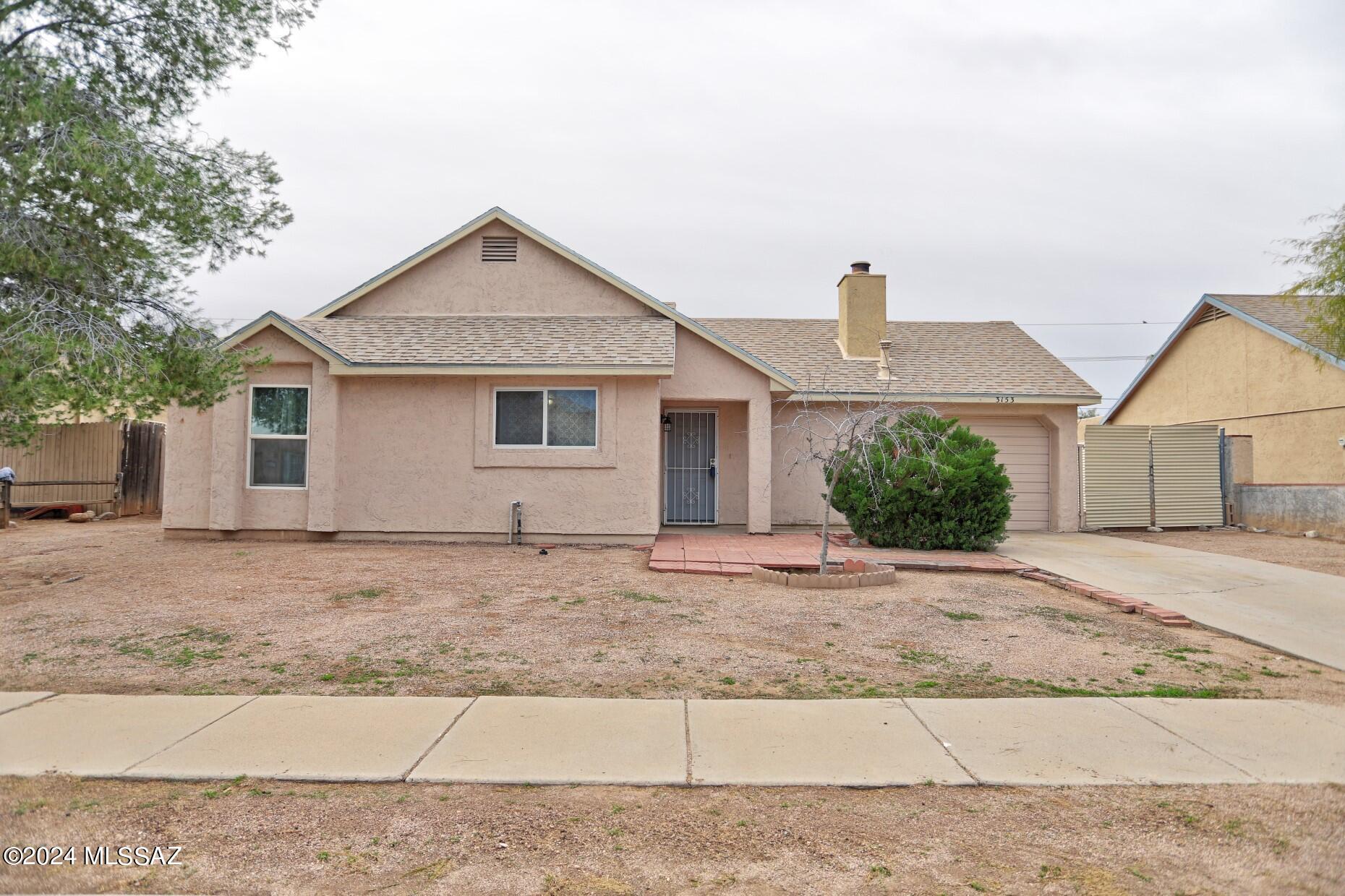 Don't miss this move in ready 3 bedrooms, 2 bath, 1 car garage home.  Exterior is stucco finish, large lot with pull thru garage and double gate., lots of possibilities. Brand new kitchen cabinets, spacious pantry, gorgeous granite countertops, double oven, electric induction cooktop plus a built-in microwave.  Designer inspired finishes includes Oil rubbed bronze hardware, LED light fixtures with new tile surround and special tile accents in both bathrooms. No carpet, ceramic tile throughout. Large living room with cozy wood burning fireplace. New French doors with integrated blinds in living room.  All these updates make this the best home in the neighborhood, don't miss  this move in ready home.
