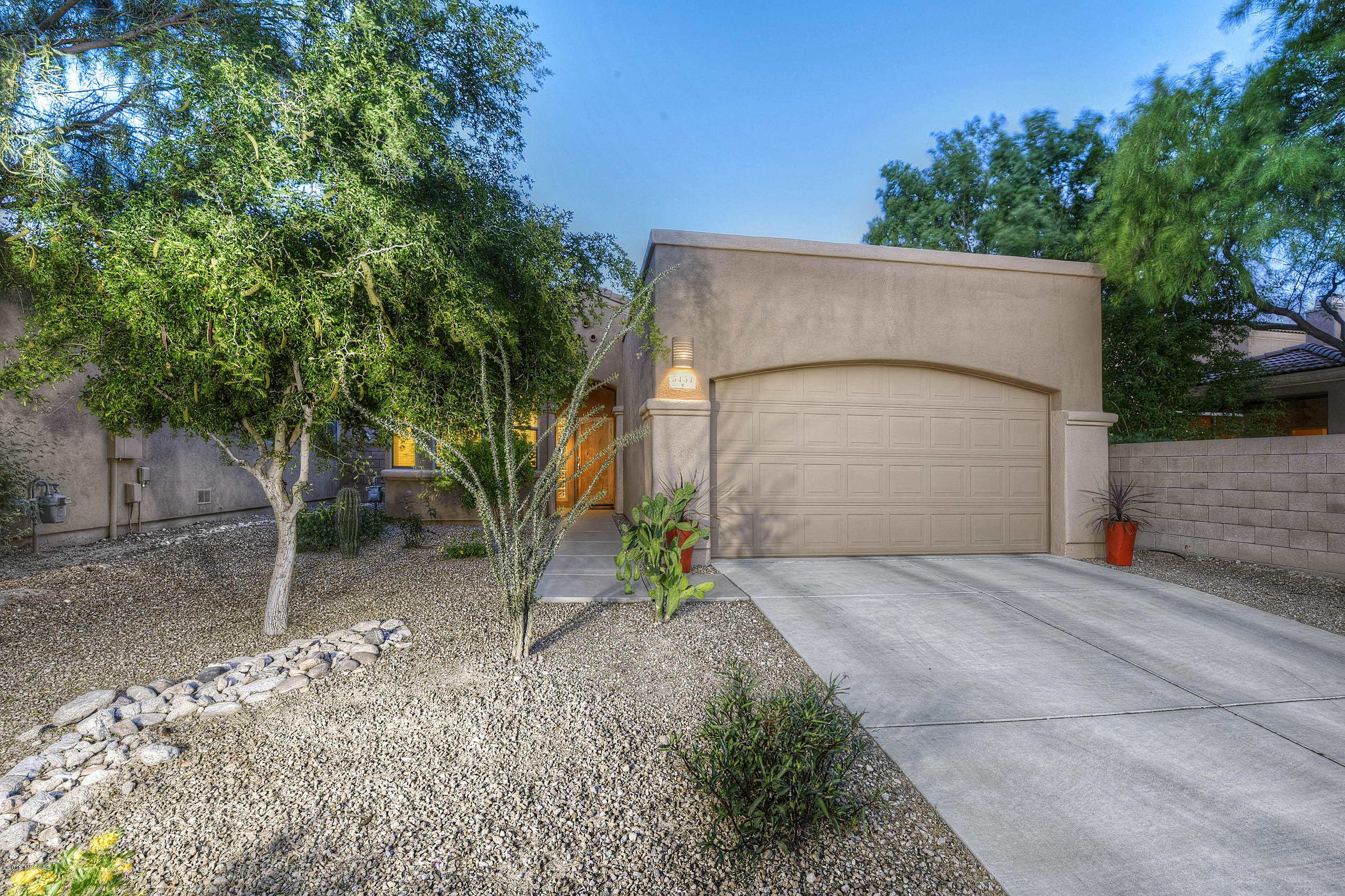 Gorgeous AF Sterling home with one of the larger backyard spaces in community. Foyer welcomes you into vaulted ceiling great room floorplan with larger ceramic tiled flooring. Upgraded kitchen complete with granite counters, glass tile backsplash, New Kenmore Elite stainless french door refrigerator, bay window breakfast area, pantry, and breakfast bar! Expansive great room with clerestory windows, dining area, gas fireplace, and patio slider door to backyard. Hallway leads to two good sized bedrooms with attractive grey wood plank look ceramic tile floors. Separate laundry area off two car garage with front load washer and dryer. Grand master bedroom with massive walk in closet, dual vanity bathroom and backyard slider door access. Turf grass, firepit, and covered brick patio backyard, Freshly painted exterior! Must See!!!