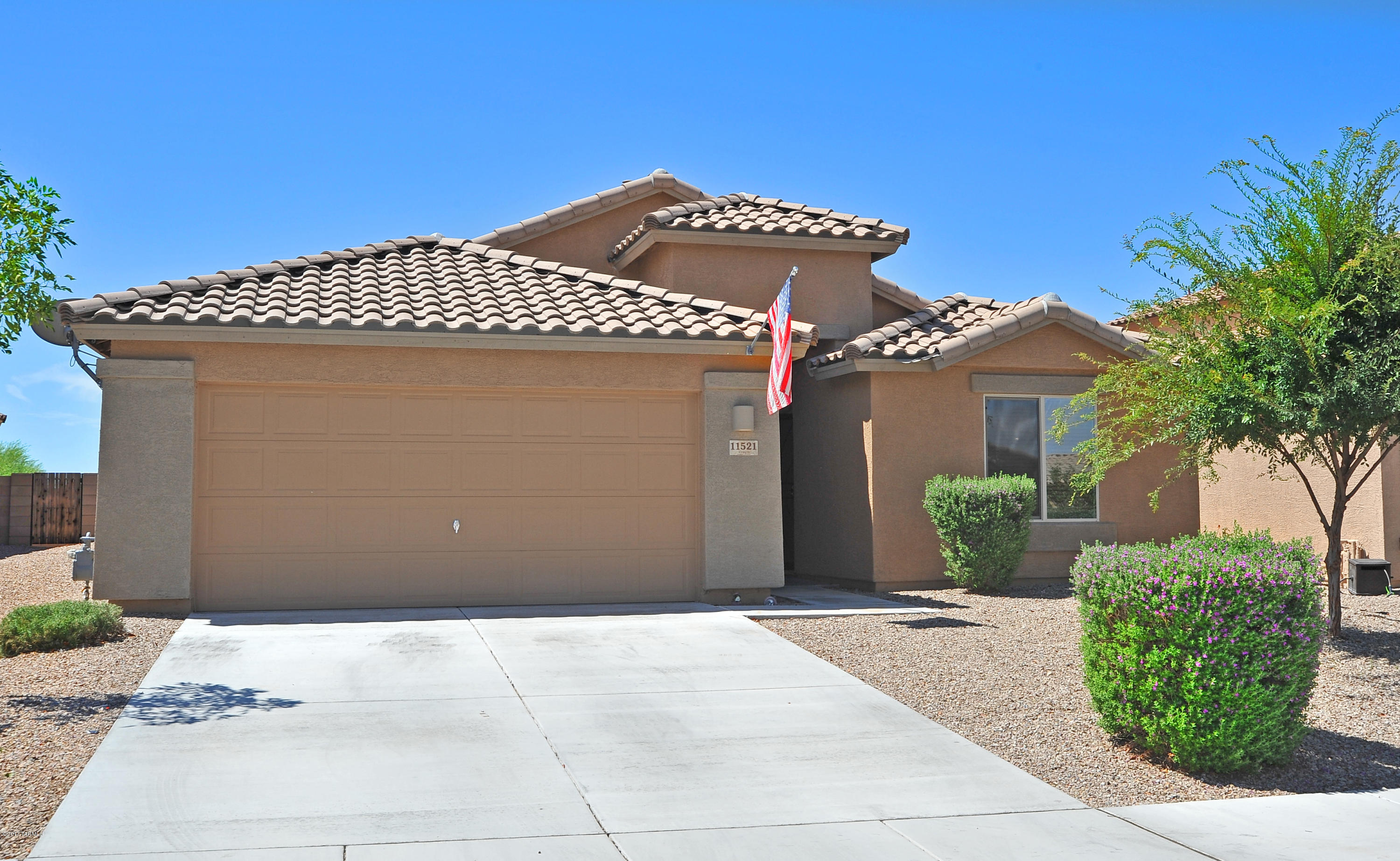 Charming 4 bed/2 bath Marana home located in the desirable San Lucas community. Home features fresh neutral paint scheme, beautiful wood-like vinyl planks throughout, including the master. Entrance opens into separate living room and dining area.  Hallway leads into spacious family room kitchen with adjoining eating area. The Kitchen boats espresso cabinets, laminate counters, black appliances, pantry closet, island with decorative tile accent under seating area. Laundry includes shelves. Ceiling fans in all bedrooms. Master bedroom includes large walk-in closet and en-suite with extra-long vanity. Entertain guest outside under the covered patio or lounge in the grass. Low-care yard includes extended paver patio with surround seating perfect for a fire-pit. Community park nearby