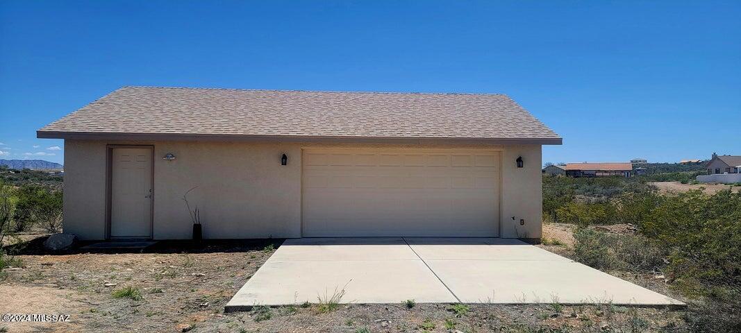 A great start to finish! Over 2 acres of land with a 24 x 36 site built garage. The garage is wired for electric that is on the property but garage is not yet hooked up. Garage has a 3/4 bath and a hot water heater. A 1000 gallon septic system is installed and property is surveyed. This property is in a peaceful, residential setting just minutes from the heart of Tombstone. It offers pleasing mountain views and an easily traversed dirt road leads to property.