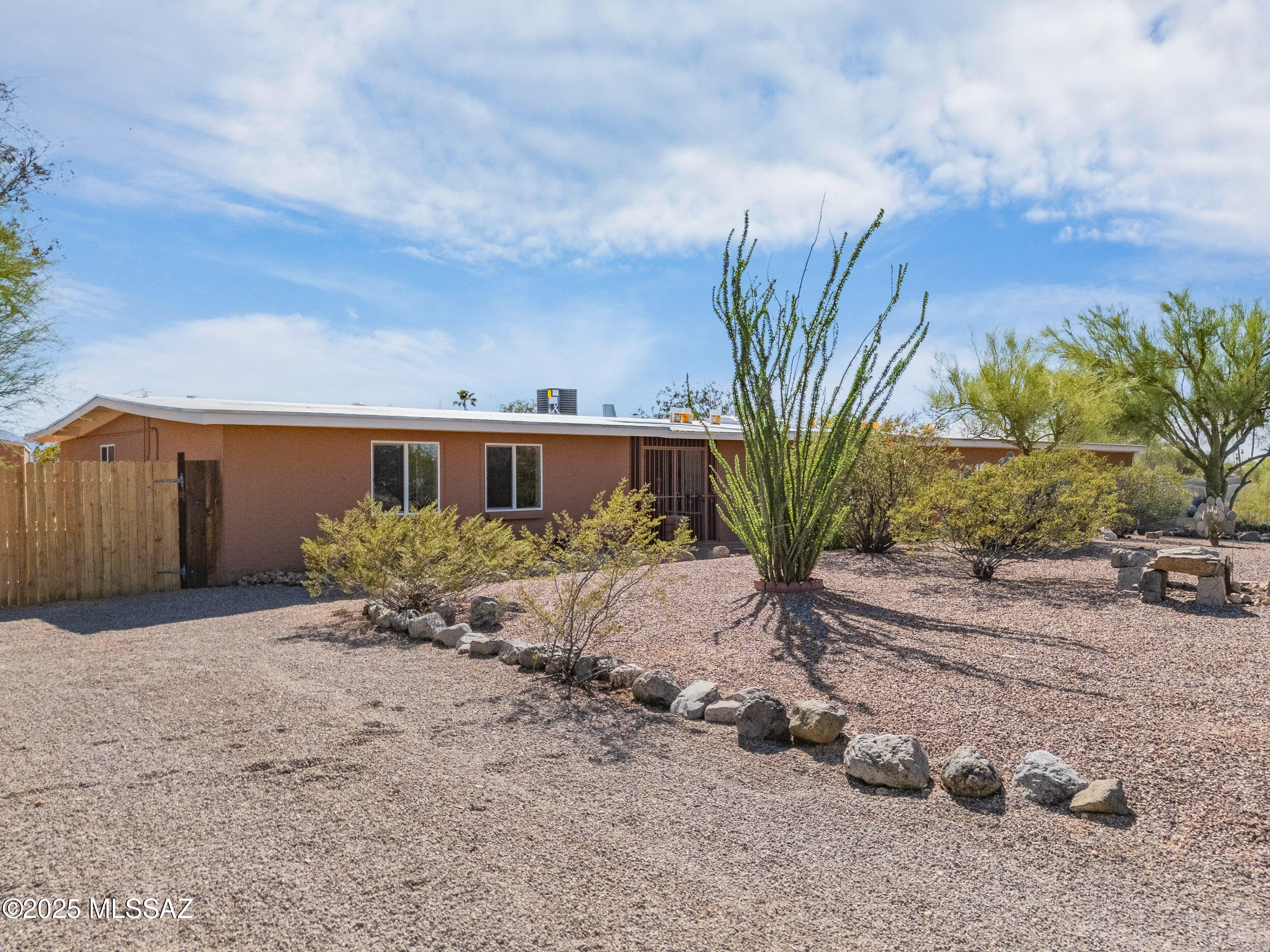 Set on over an acre in prestigious Casas Adobes Estates, this beautifully remodeled home offers sweeping mountain views, exceptional privacy, and endless possibilities. The spacious layout includes two separate living rooms, perfect for entertaining. The modern kitchen features sleek cabinetry, contemporary finishes, and flows effortlessly into the main gathering spaces. Both bathrooms are fully remodeled with high-end, stylish touches. Major upgrades—brand-new roof, HVAC, and dual-pane windows—deliver comfort and efficiency. Outside, the expansive lot is a blank canvas for your vision: add a detached guest house, garage, or workshop, create a pool retreat, or simply enjoy the open space. Plenty of room for RVs, toys, and outdoor living in one of Tucson's most sought-after neighborhood