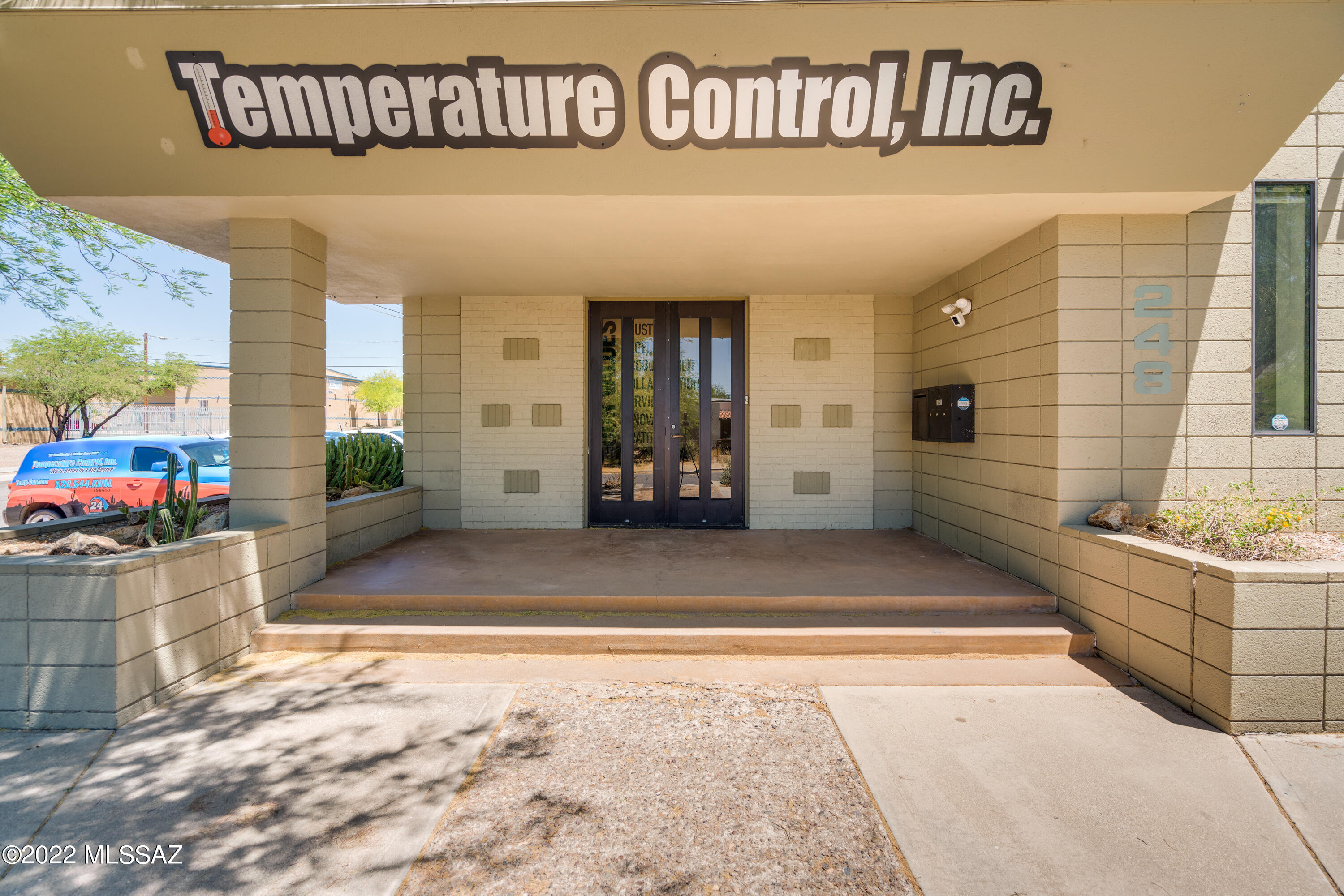 Premier retail opportunity! This commercial office building can be conducted as an individual business or sublease the individual office suites. This building features 5 offices, 2 bathrooms, a kitchenette, a reception area and a bonus room (ask agent for details). Building and 40' shipping container is already equipped with security system and fenced/gated back lot. 40'shipping container conveys. 2 20'shipping containers with shade structure DO NOT convey. Free standing shade structure conveys. Parking along side of building with parking expansion at back lot.