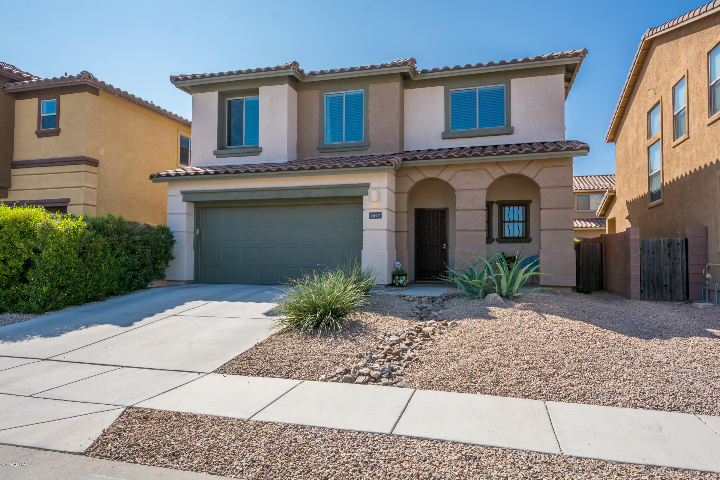 New listing in popular Paseo Del Rio Subdivision. Extremely well cared for two story Meritage built home that has just been painted outside.  Very open floorplan with living room, powder room, dining room, and kitchen that view beautifully landscaped yard and covered patio.  Upstairs has three bedrooms all with California closets, two full baths and a den that would be a perfect ''work from home spot''.  Large community park across the street features a ramada with tables, basketball court, and grass field with playground equipment.