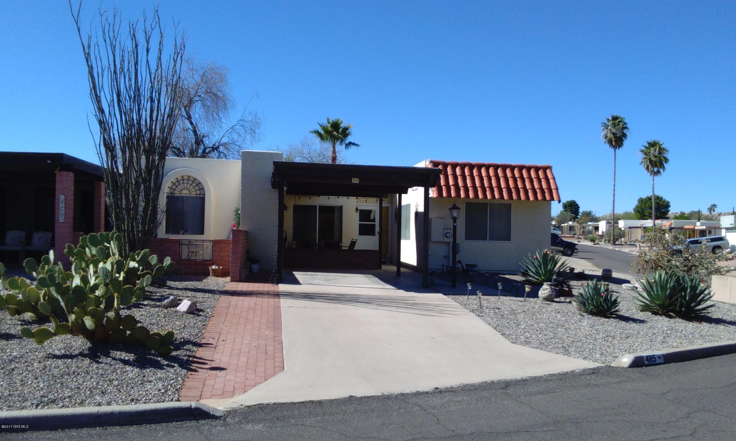 Corner lot two bedroom two bath townhome Nice patio area of the Arizona room. Enclosed back yard backs up to common area. Great winter residence or rental. furniture available. Nice front patio with laundry area in storage room.