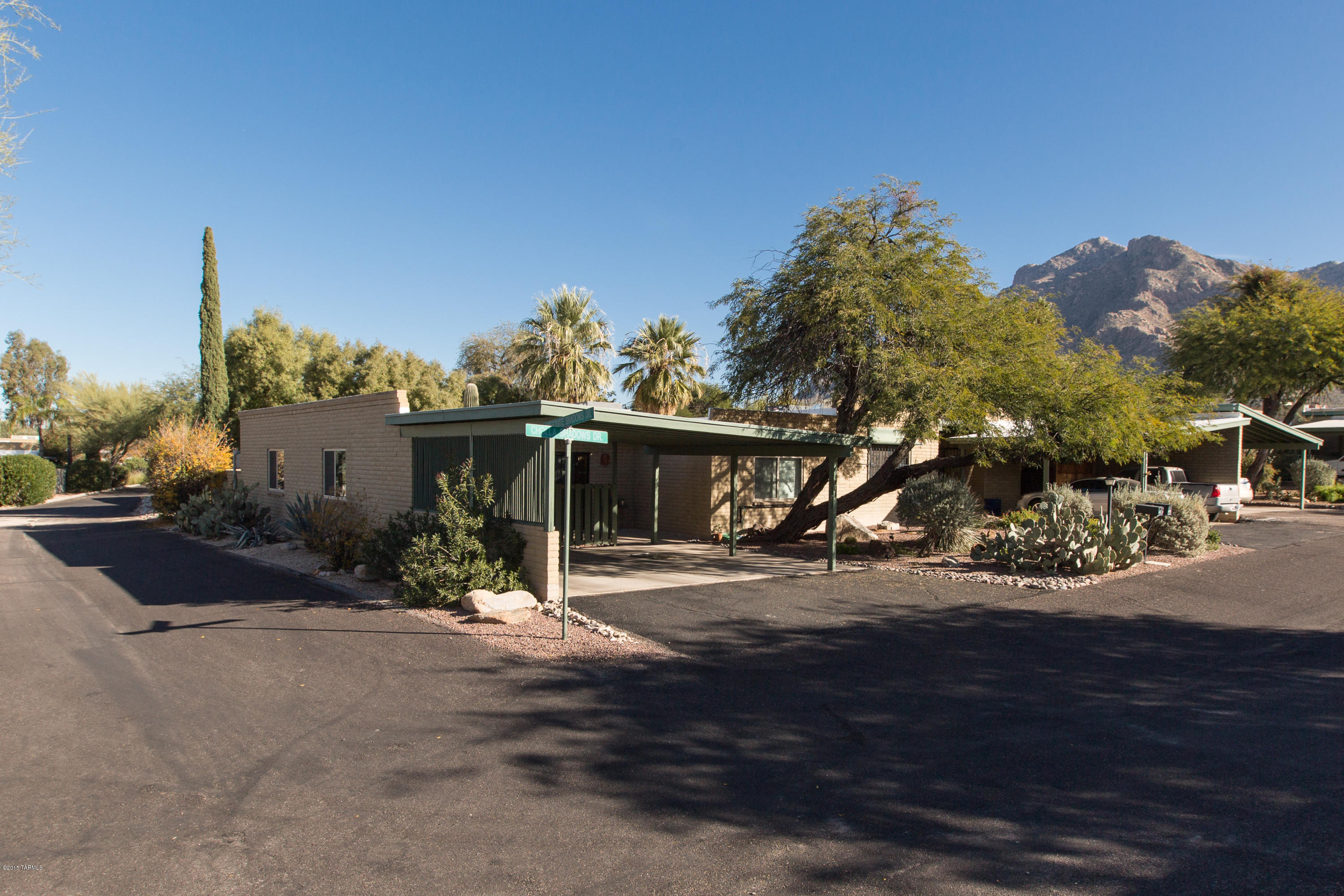 Location, location, location! Charming masonry townhome in desirable Verde Catalina Townhouses, on a wonderful corner lot. Quiet neighborhood with mature trees nestled under the Catalinas yet close to shopping and restaurants. NEW HVAC, windows and updated baths. Raised ceiling in kitchen along with new flooring and lighting- no popcorn ceilings here! Mountain views from the private back paved patio make this home a must see! Perfect for young couples, winter visitors, and investors alike...this home is just waiting for your final touches to make it your own!