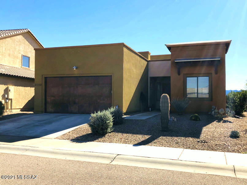 Nice 3 Bedroom 2 Bath Split Floor Plan with the Great Room with 12' Ceiling. Backyard offers stunning Quarry Pines Golf Course Views, Sunset & Tucson Mountain Sombrero Peak views. Kitchen features Beautiful Granite Counter Tops, 42'' Cabinets w/plenty of storage space & stainless steel appliances. Large Eat-in Breakfast area in Kitchen & Dining Area are Great for Entertaining. Master Suite has sliding glass door to patio and views. Master Bath has Dual Sink Vanities with Granite counter tops, Large Walk-in Shower & spacious Walk-in Closet. One Bedroom has Double Doors, Huge Walk-in Closet, great for storage. Tile throughout with Carpet in Bedrooms. Enjoy the backyard with extended covered patio, Located in a friendly community w/park, nearby shopping, restaurants, movie theater, river walk