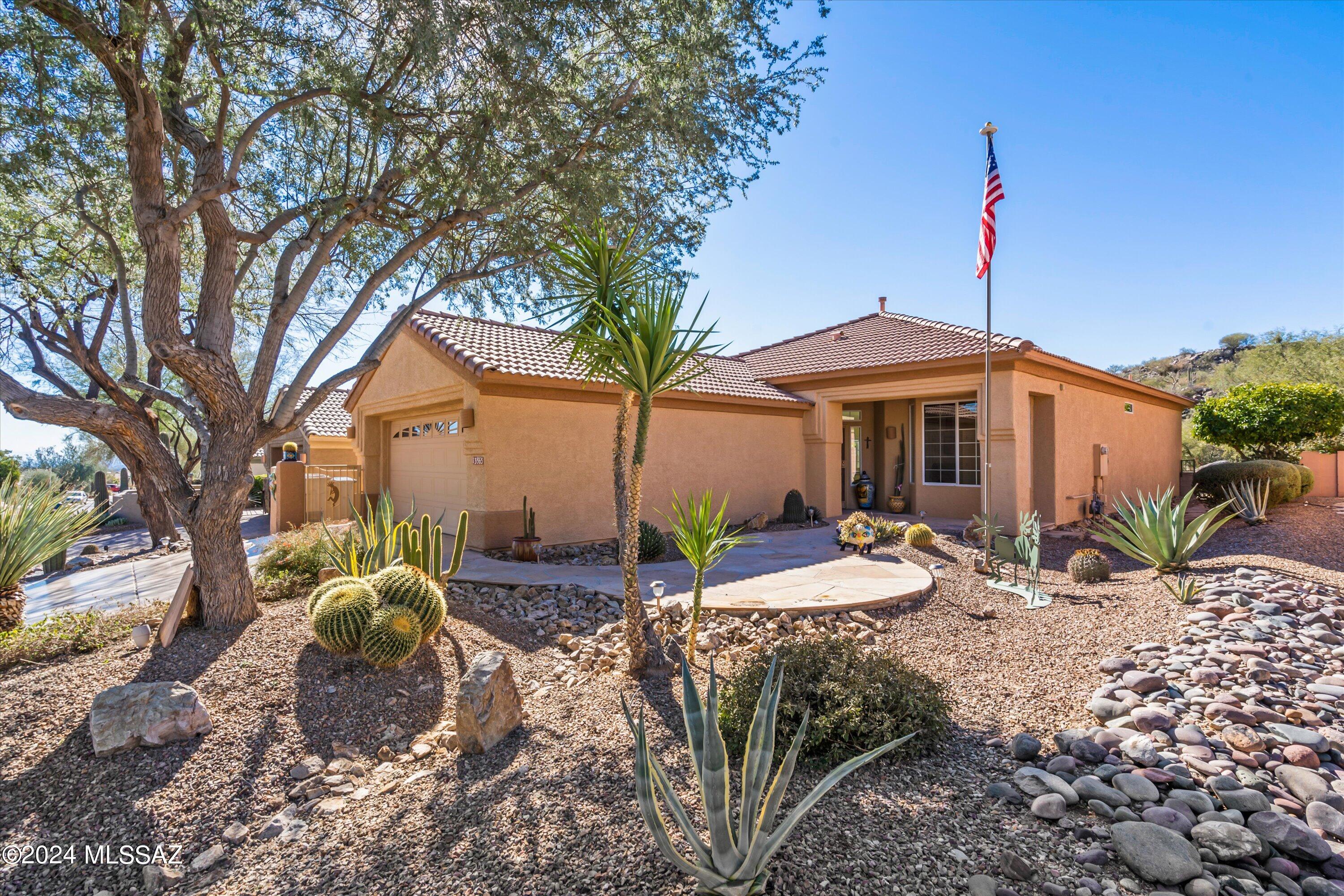 Located in the highly desirable Highlands at Dove Mountain, this home is located on a great homesite with a spectacular view of Arthur's Hill, the 13th green and some desert space. This backdrop provides the perfect setting for backyard entertaining on the flagstone patio complete with bbq island. Durango Floorplan with builder extensions in the laundry rm, front bdrm and garage. This home has been well maintained, the HVAC and water heater replaced in 2022. The home has many features including crown molding, upgraded baseboards, marble shower and more. The community offers an award-winning golf course, restaurant, exercise room, pool/spa, pickleball, social events & more. See Features List in Document Tab. Additional community information can be found at www.TheHighlandsatDoveMountain.com