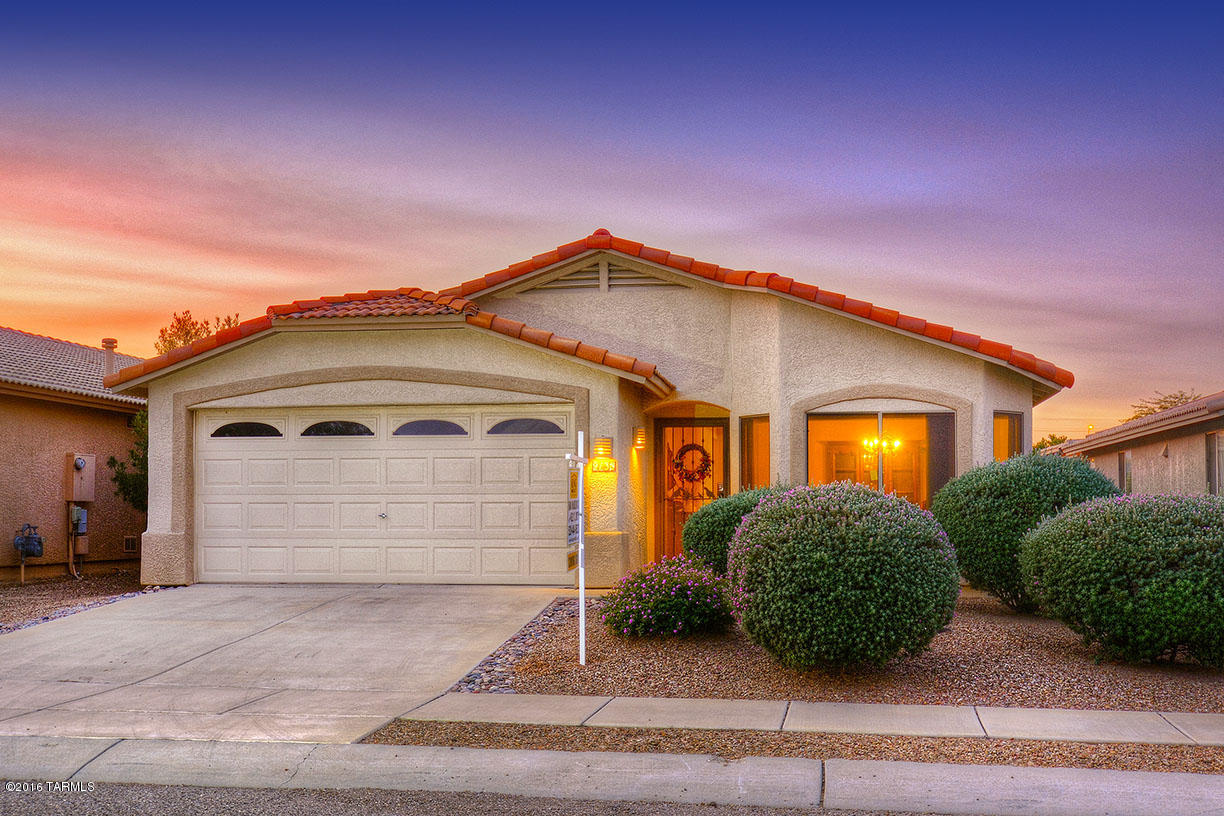 Picture Perfect! Meticulously maintained, one owner gem on Tucson's near SE side! This lovely 3 bedroom 2 bathroom home is adorned in a tasteful, neutral palette from floor to ceiling is sure to please even the most discerning buyer! Enter through the large formal living room (Current owner used as formal dining)-plank wood flooring showcases the rooms' volume and flows through to spacious-eat-in kitchen. Kitchen's ceramic tile flooring makes clean up as snap! Kitchen appliances and counter tops are spotless and provide fantastic prep/cooking space. Floor plan flow continues from kitchen to family room, where views of the enclosed patio/Arizona room afford backyard entertaining the whole year round! The walled, private rear yard has been professionally maintained and provides ample room for a pool, play set even a putting green!