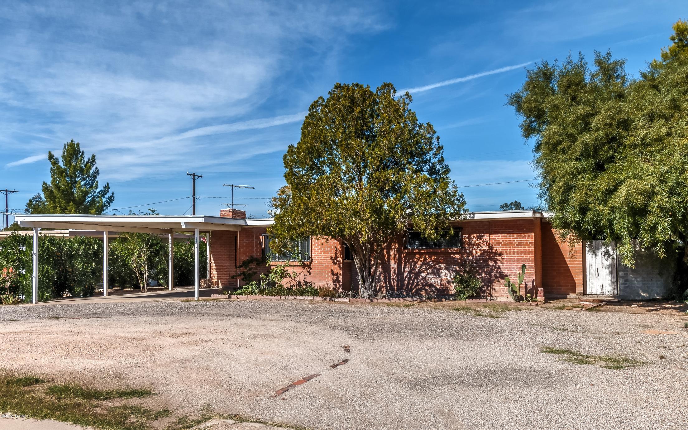 Generous brick home with many extras. New carpet, newer A/C, 200 amp electrical service, big front and back yard, extra rooms for many uses such as office, shop, sewing, hobbies, storage, walk in closet or many more. Close to the University, Downtown, I-10, Shopping, etc. Well maintained, ready to move in, now. Bonus sqft not included in Assessor. Sold as Is.