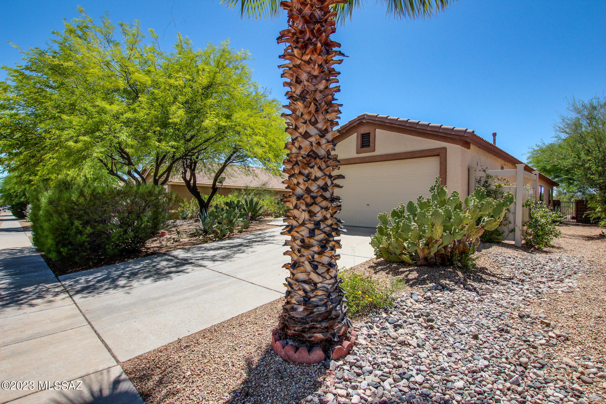Fantastic Mountain Views! Nestled in the quiet Tucson Mountain Sanctuary neighborhood, you will find this wonderful 4 bedroom 2 bath home! Open feel with vaulted ceilings and arched doorways. Spacious Great Room and kitchen with gas range, pantry closet and ample counter/cabinet space. The Primary suite offers separate shower and soaking tub, double vanity and large walk-in closet. Enjoy the private backyard, well maintained, covered patio, no rear neighbors and view fencing for those amazing mountain views!  OWNED SOLAR! (Average bill $40/month) Come take a look!