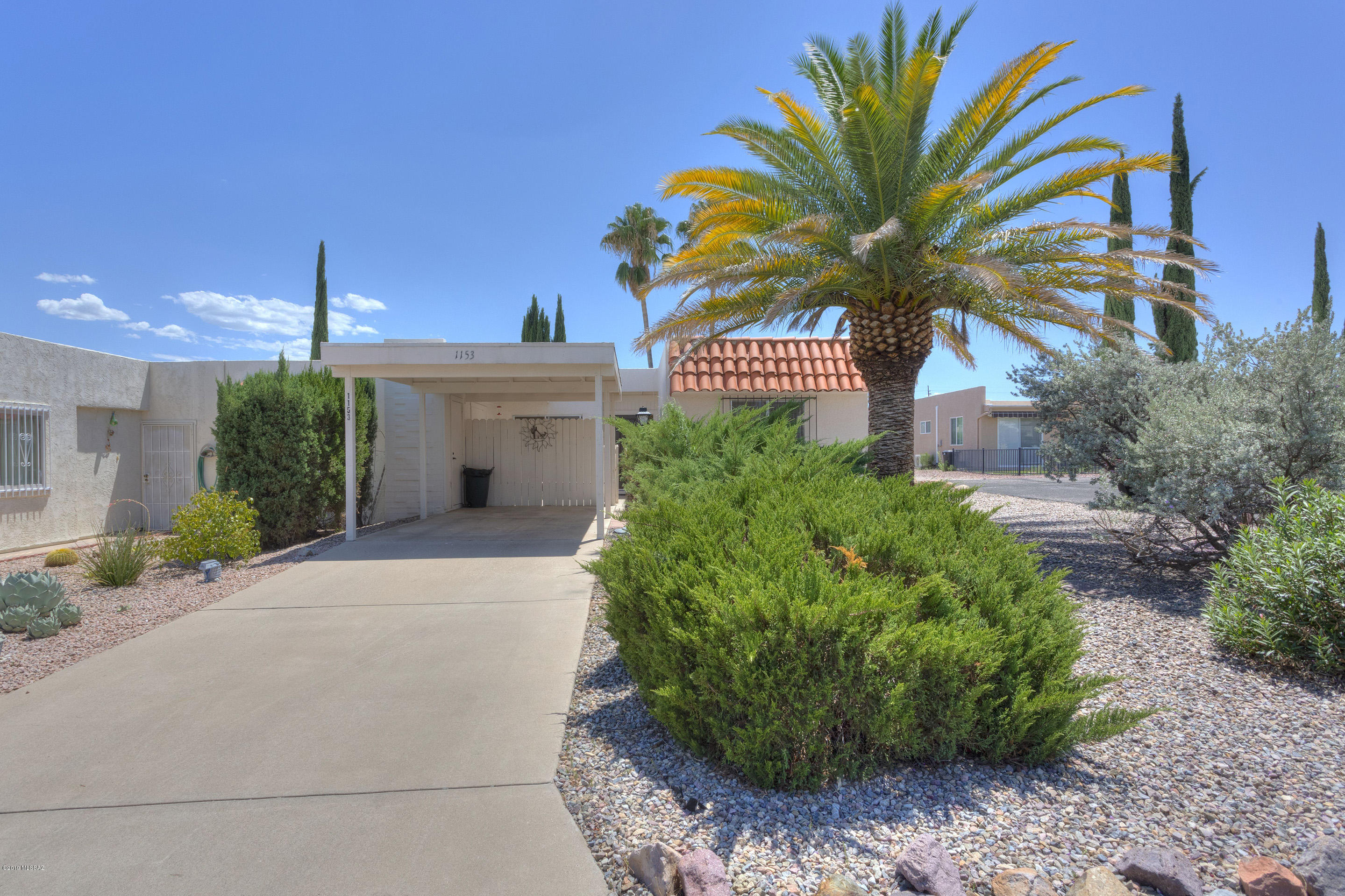 Desirable end-unit in the Desert Meadows  Townhomes community. This home has new carpet, an updated kitchen and updated bathrooms. Maybe the best location in the community with parking next door, South facing backyard for mountain views, and some space between you and your rear neighbor.  The truly serene Desert Meadows Park is within walking distance, virtually at the end of the street. Private front patio is a great place to relax. Refrigerator, washer and dryer are all included. GVR offers pools, gyms, sport courts, classes and unlimited social activities.  Schedule a showing today. This one won't last long!