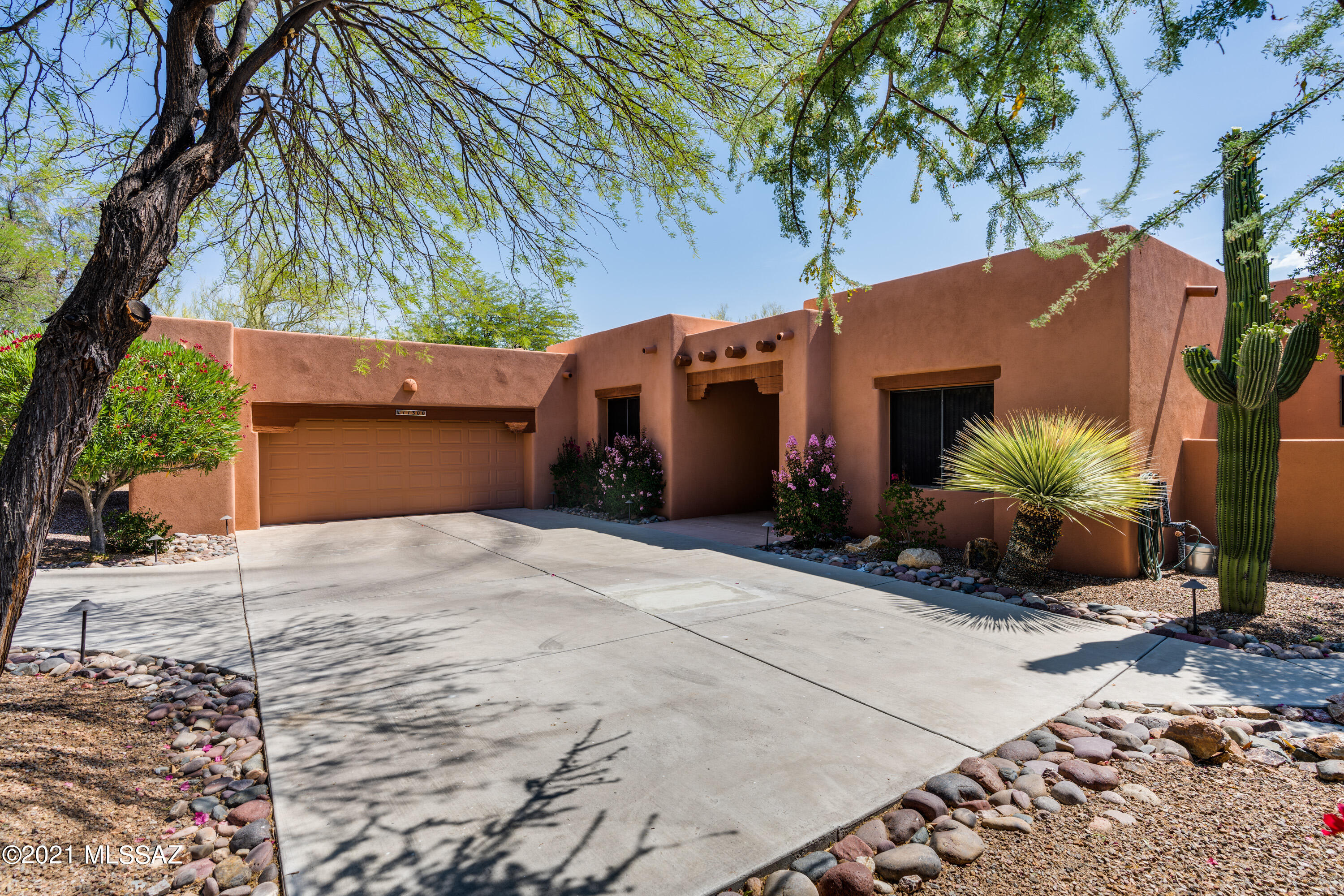Oro Valley living at its finest! Immaculately cared for custom built home sits on a third of an acre on a quiet cul-de-sac street. This Santa Fe home built with Integra block has an oversized 2-car garage, 4 bedrooms & 3 baths. Gourmet kitchen boasts granite counters & backsplash, tremendous cabinet & counter space, gas stove top, desk & stainless appliances. Great room with gas fireplace, vaulted ceilings & ceiling fan. Additional features full home remodel in 2013, new HVAC system in 2018 & laundry room with sink. Enjoy the backyard oasis complete w/ extended enclosed patio with electric rolling screens, custom landscaping with fruit trees, outdoor kitchen with wood burning fireplace & heated pool & spa. Must see!
