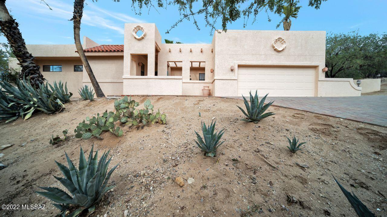 Hilltop home with sweeping mountain, golf course, and sunset views! Sit and relax at one of the five outside sitting areas/patios and enjoy the peace and tranquility of your private oasis. Step through front door and be greeted by a wall of windows bringing the beauty of nature inside. Open & bright great room concept w/ plenty of space for entertaining, while maintaining the feeling of warmth & charm throughout. Large kit w/island, custom cabinetry, breakfast bar, 3br, 2.5 baths, lrg walk in showers, intimate sitting area off kitchen w/2 way fplc and so much more! This classic beauty is a great find for someone to step in and make their own. Must see in person. Pictures do not capture views! Outside Canopy destroyed by heavy winds. Seller is aware, will replace w/ color of buyer's choice.