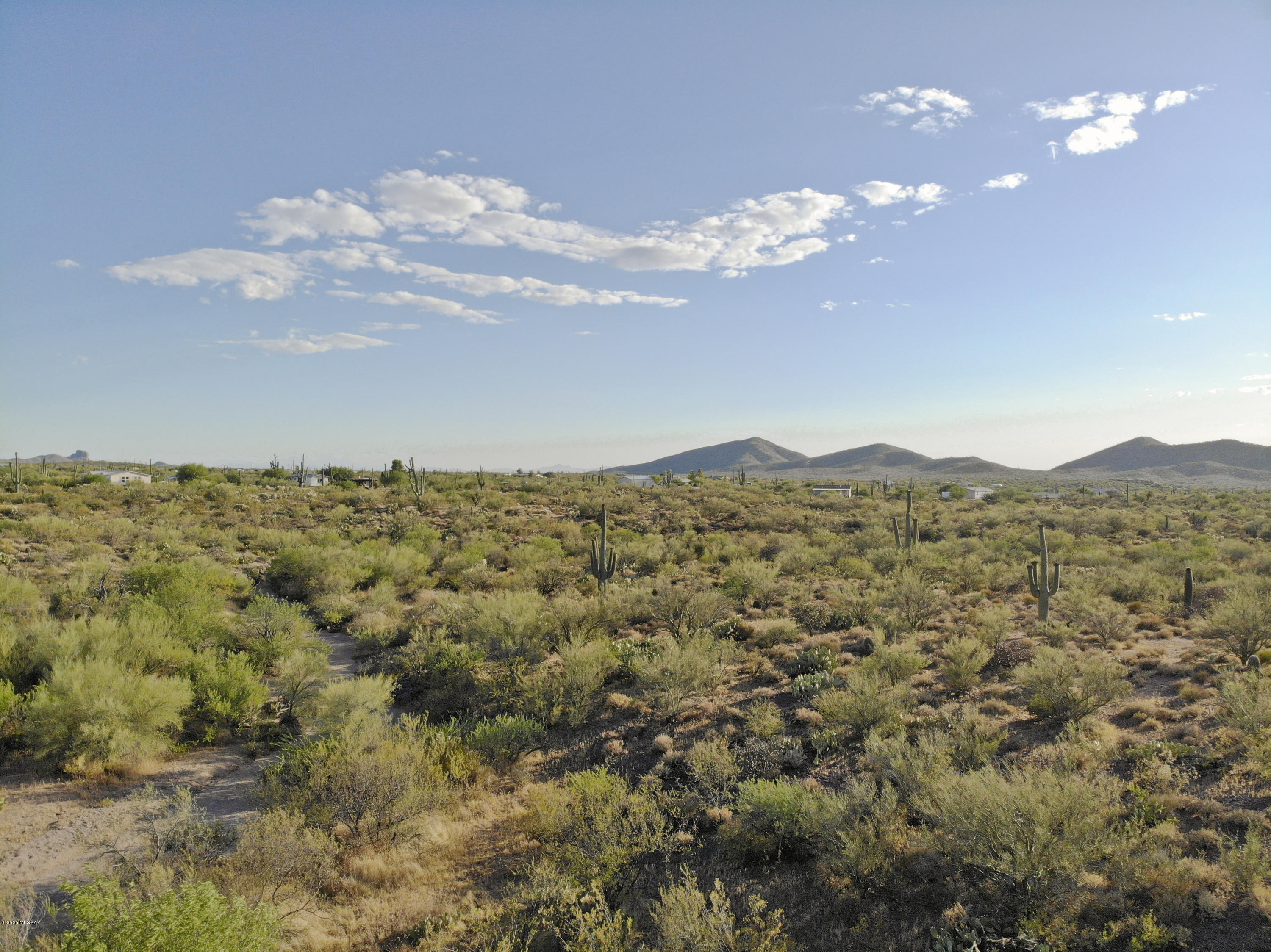 This spectacular 6.84 acre property delivers exceptional privacy & picturesque views of the Catalina & Tortolita Mountains. Comprised of two separate 3.42 acre parcles (available individually too) this acreage has numerous home site location possibilities taking advantage of the mountain views, privacy, and excellent native landscape. Electric and phone are easily accessible nearby. Two well shares convey from previously used well located just west. Conveniently located nearby to Highway 79 north of Park Link and just up the street from the rustic Cadillac Chaparral restaurant. Nearby to Florence & NW Tucson