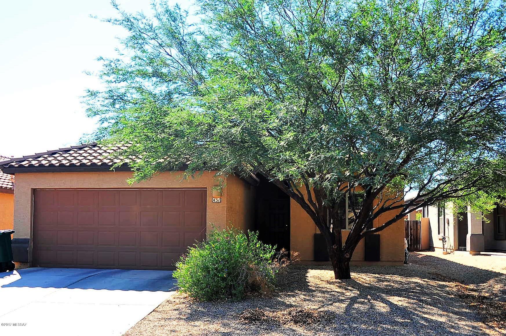 3rd Bedroom is converted Den, could be either. CHARMING BRIGHT 2 BEDROOM 2 BATH HOUSE WITH DEN ADJACENT TO LIVING ROOM. HIGH CEILINGS CREATE A LIGHT AND AIRY SPACE WHILE  WALL SHELF AND ARCHES ACCENT THE MAIN ROOM WITH A CLEAN & CRISP LOOK. SPLIT BEDROOM FLOOR PLAN MAKE FOR PRIVACY FOR GUESTS OR CHILDREN.  BEAUTIFULLY SHADED BACK YARD COURTYARD HELPS COOL THE AFTERNOON SUN. HOA INCLUDES CLUB HOUSE, WATER PARK, 3 POOLS, SPA EXERCISE CLASSES, GYM, KID CLUB, MINI GOLF, TENNIS, VOLLEYBALL, BASKETBALL, WALKING/BIKE PATHS. SAHUARITA LAKE, FISHING,  DOG PARK & FREE COMMUNITY EVENTS.