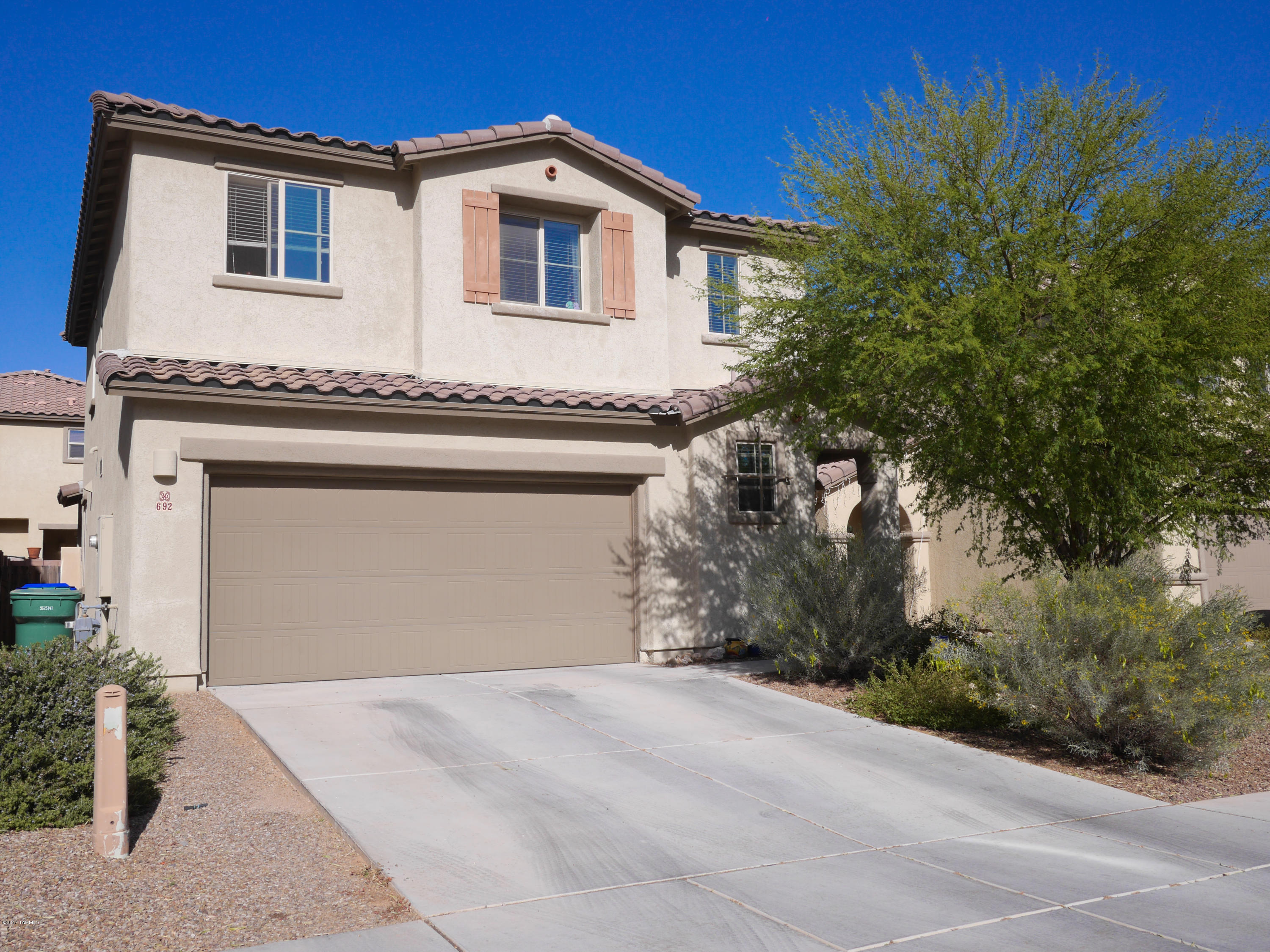 This home is truly a cut above! Located in the heart of friendly Rancho Sahuarita, this home has it all! Extensive upgrades throughout! Premium granite counter tops, premium cabinets, stainless appliances, cable/data lines in every room, EnergyStar certified, the list goes on and on! The home lives perfectly with open concept kitchen and expansive great room! Upstairs, a loft/flex space makes for comfortable modern living. The master suite is expansive with great closet space and counter space in the master bathroom! The north facing backyard is setup with premium artificial turf, low care landscaping, plumbed with gas for the BBQ, and remarkable privacy. Its the perfect setup for entertaining! This home and its design choices are perfection!