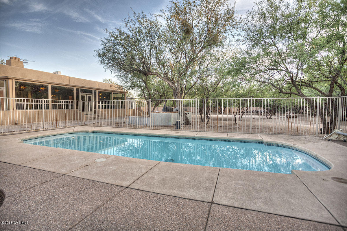Seller will counter or accept offers between $399,500-$409,000. Nestled in a mesquite bosque in highly desirable Tanque Verde Loop area, this custom southwest home is ready to enjoy on 1 acre with NO HOA. HUGE Bonus Recreation Room that has been known to host parties of 100+ with 2 built in bars, wine fridge, and ample space for gatherings, game room, etc. Cooks kitchen with storage galore, beautiful Hickory Cabinets w/slide-outs, center island & 3 ovens. Over-sized 2 car garage, sparkling low-maintenance pool, and large built-in bbq island. So many extras that are sure to impress. No work needed-move in ready...just bring your boat, RV & Toys, there's plenty of space!