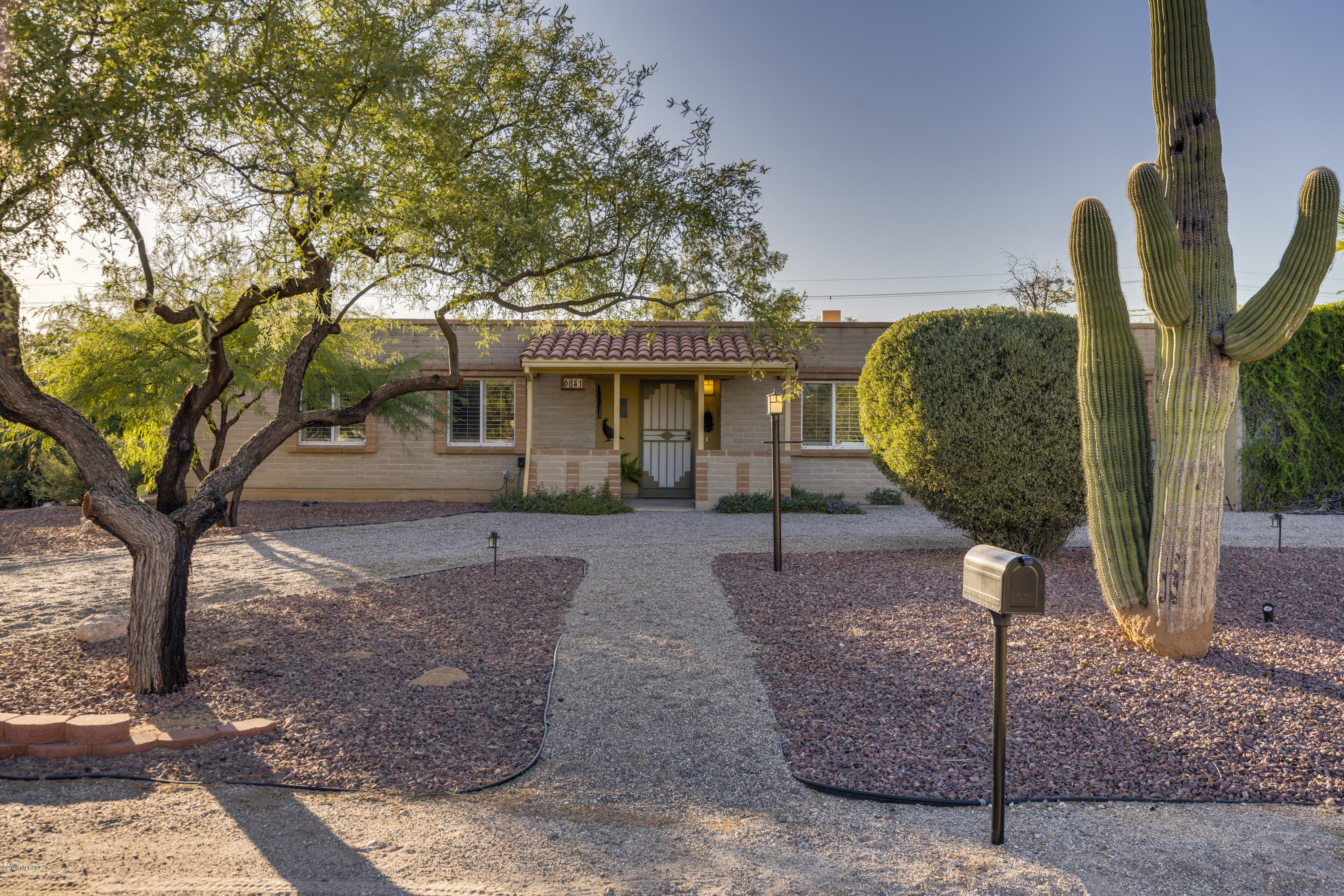 Fantastic home, loved & updated, with tons of space to spread out, in a great location too! Home offers 3 bedrooms & 3 full bathrooms, plus a large media room, which could easily be converted to a 4th bedroom/guest suite using 3rd bathroom. There is also dedicated & separate office space with two built in desks, plus storage space - great work from home set-up! Kitchen is nicely appointed, spacious & open to living room. Large fireplace with dual opening to living room & family room, creating two wonderfully warm spaces.  Oversized garage, with large workshop & full enclosed storage room. Also, newly replaced plumbing lines & updated bathrooms.  Mature landscaping, gardens & sunset views cap off this wonderful property. No HOA!  Membership at private pool is available, just up the street.
