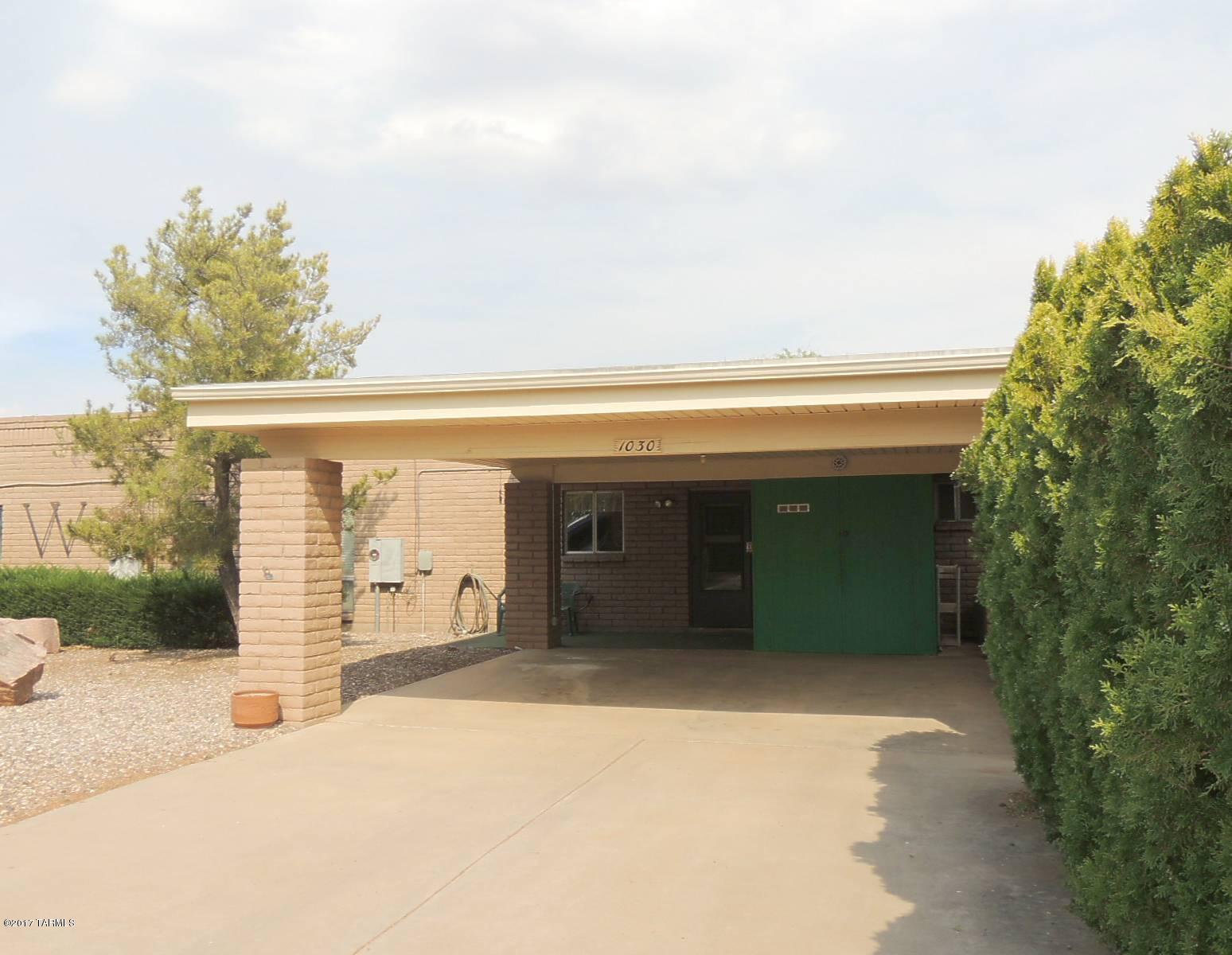 2 Bed / 2 bath, 1,400sf townhouse for sale in the quaint little village of Sunsites.  End Unit!  This home is neat as a pin with a terrific floor plan that separates the bedrooms to allow privacy when guests some for a visit.  Each bedroom has a door out to the enclosed Arizona Room.  The backyard has a brick fence with a gate - perfect for pets!  The home could use some updating but at this listing price, it can't be beat! This townhouse is the first one in a row of 5 homes that most folks would say are the nicest in the village!