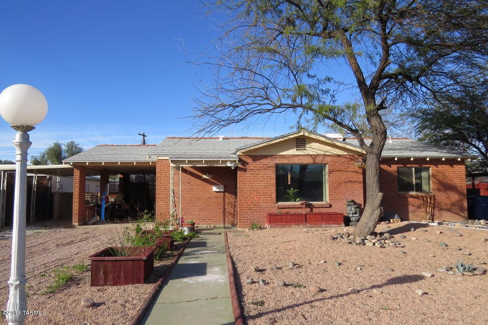 One story solid brick home with 4 bedrooms, 2 baths. Ceramic tile throughout- 1630 sq. ft. plus 870 sq. ft. (rear) studio/exercise room or workshop with half bath and cooling. New roof on main house and studio- Oct 2014. New hot water heater- June 2014, interior re-piping- Nov 2014, dual cooling, large fenced yard, low care front and rear landscaping.
