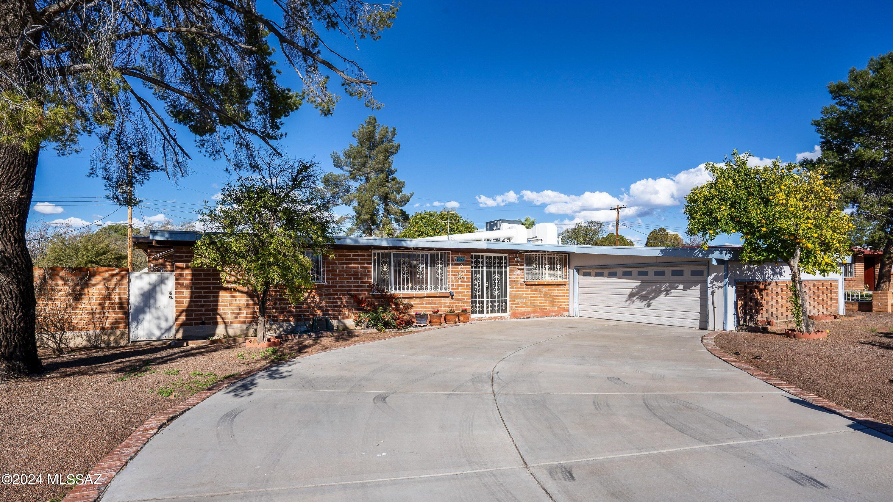Price improvement! Welcome to this inviting, charming brick home on 0.2 acres! Enjoy lots of living space for your entire family, including an Arizona Room used for entertaining, rec or workout area. Outside is a beautiful a patio with courtyard, fruit trees, spa, separate backyard space and storage. Updates include:  2023 Dryer Heating Element, 2022 Roof Re-coated, 2021 HVAC, 2022 Range, Fridge, Faucet, Garbage Disposal, Bath shower/tub resurfaced, spa cleaned & new filter, garage door motor, sewer cleanout to front access, and 2017 water heater. All major items are done. Appliances included. Furniture available. This one has it all. Come get it before it's gone!!