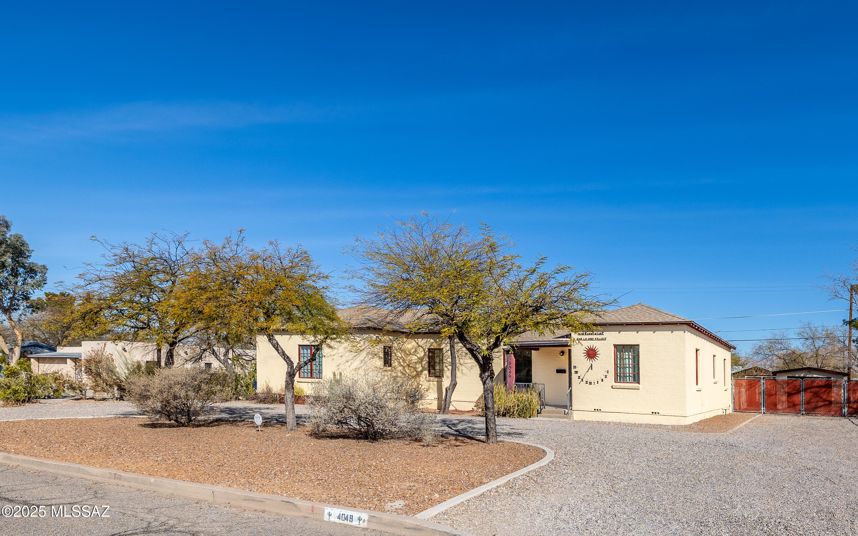 This beautifully updated home, featuring hardwood floors throughout, seamlessly blends historic charm with modern elegance. Originally built in 1939, with a thoughtfully designed primary suite addition in 2011, this spacious 4-bedroom, 2-bathroom residence is perfectly situated in central Tucson—just a short walk to Reid Park and less than five miles from the University of Arizona.

The expansive backyard offers breathtaking mountain views, providing an ideal space for outdoor entertaining or the potential to add an auxiliary dwelling unit. A unique highlight of the property is an historic sundial, believed to be the oldest in Arizona.

Inside, the stunning primary suite features his-and-hers walk-in closets and a luxurious en suite bathroom with a soaking tub, walk-in shower, and dual vanity. The kitchen is equipped with sleek, modern appliances, while the inviting living room showcases vaulted ceilings with exposed beams, adding warmth and character. This home offers the perfect blend of timeless appeal and contemporary comfort in a prime location.

Seller is a licensed real estate agent in the state of Arizona.