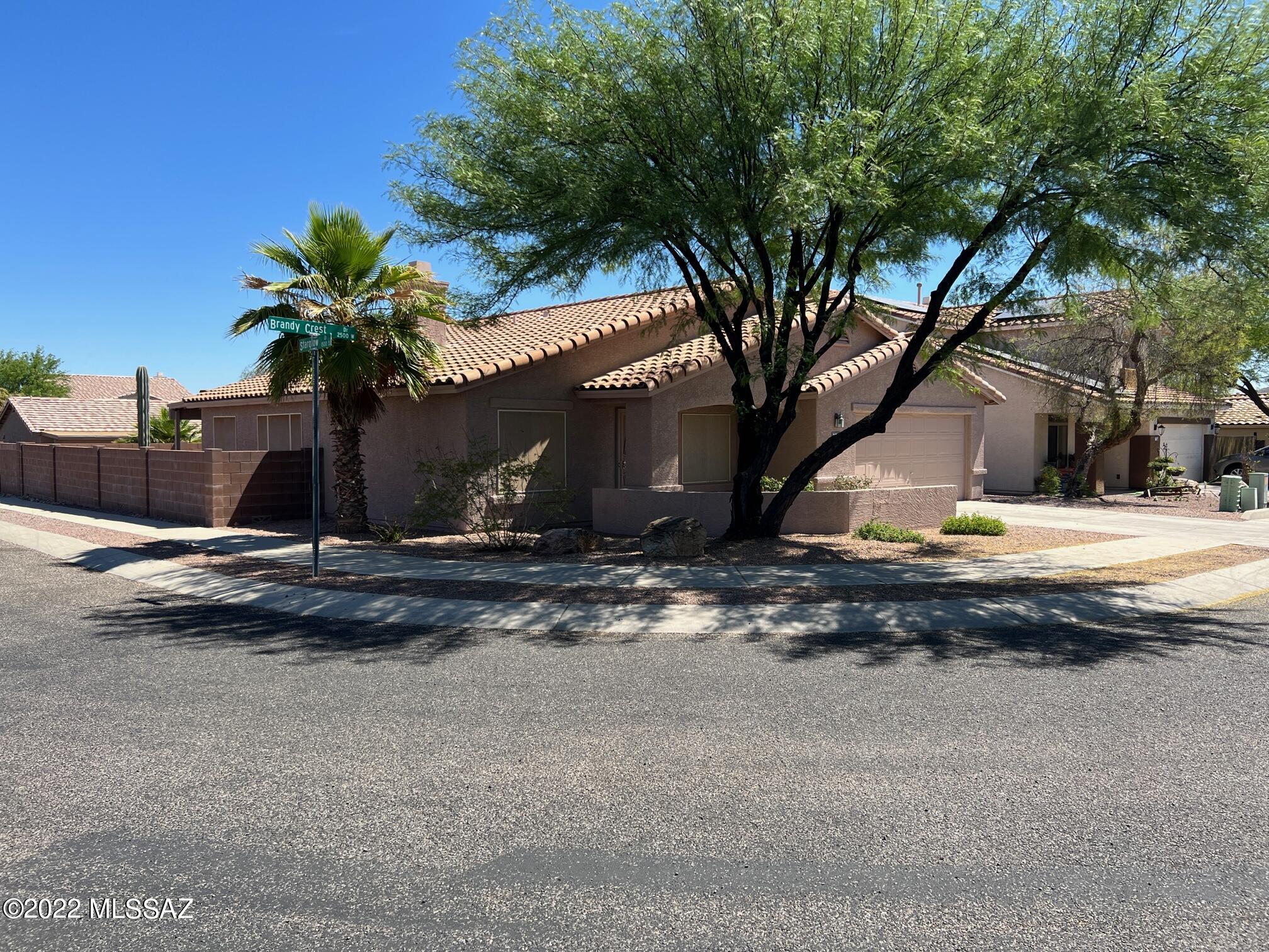 This is an amazing home on a corner lot 
 Great location in the Starr Pass area. Open floorplan with vaulted ceilings.  Gas fireplace. Bay window in Master bedroom. Double sinks in both bathrooms. Super nice ice tile floors. Built in BBQ and faux grass.  Huge covered patio with large paver area.