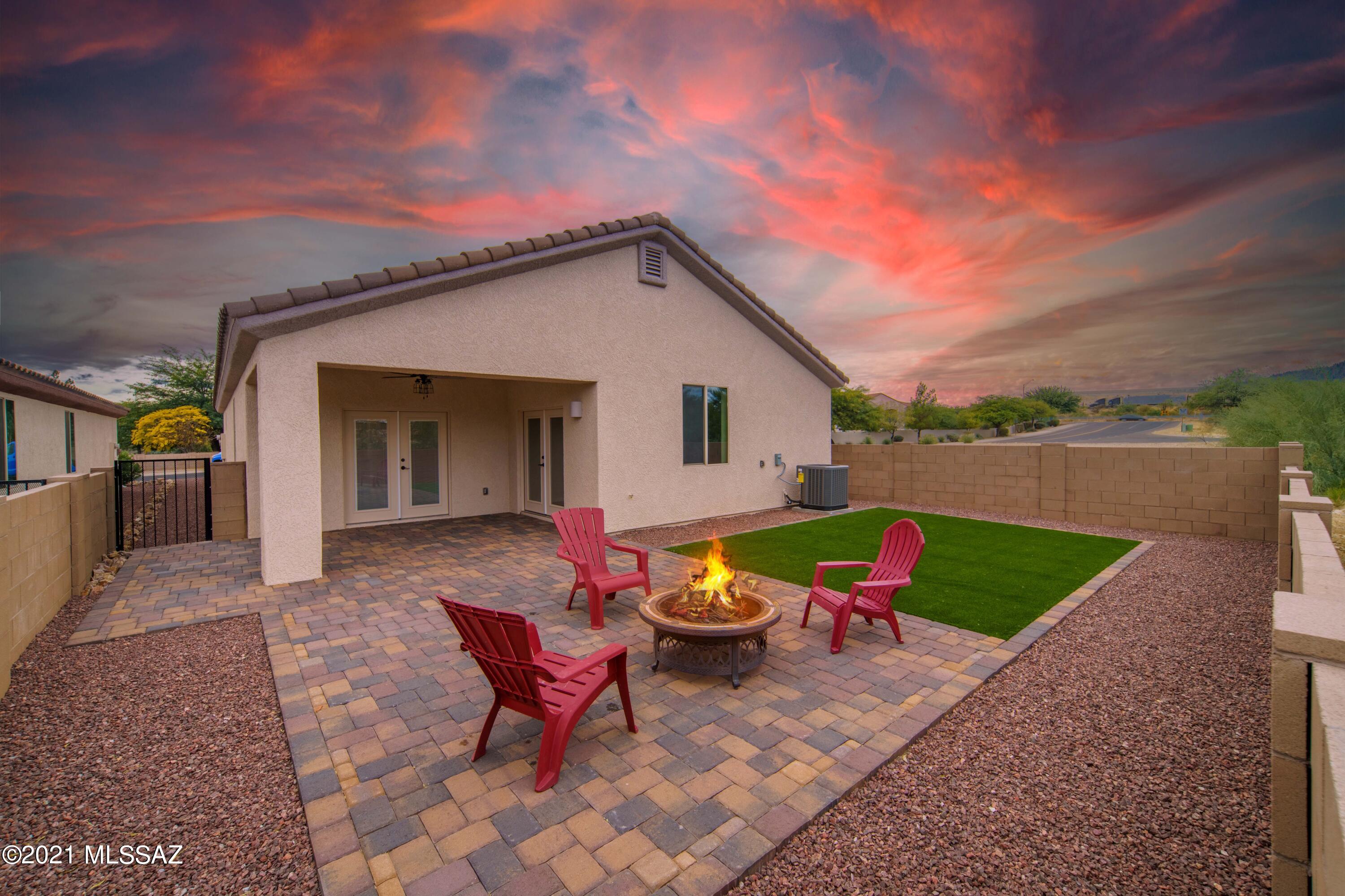 Welcome to your brand new home nestled in the heart of Green Valley, one of the top Retirement communities nationwide! This superior location offers close proximity to the Torres Blancas Golf Club, shopping, dining, hiking and convenient highway access. Come explore new construction, without the wait! This heavenly three bedroom home features a den upon entry, all tile plank flooring, upgraded laundry room with extensive cabinetry and one of a kind bathrooms! Exquisite, custom craftsmanship is felt at every turn of this home...but the custom kitchen is sure to delight all of your senses! A beautiful honey colored hood crowns the white, soft close cabinetry and provides an elegant touch. The matching island is the center of attention topped with stunning white quartz, and provides the perfect gathering spot! The artistic backsplash makes this kitchen truly unique, while giving that cozy, modern farmhouse feel. The open great room leads to the spacious backyard through double doors, giving the true indoor/outdoor living experience. This home was tailor made for living the dream in your Arizona desert oasis!