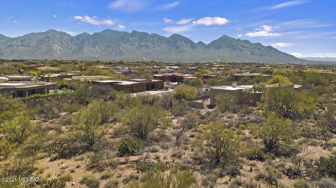 The Lot You've Been Waiting For!  This one is tucked into a lovely custom home community in the La Canada/Tangerine area of Oro Valley.  The .73 acre lot gently slopes up to capture the beautiful east facing Pusch Ridge views in the Catalina mountains.  Off street lot at the end of a cul de sac with a long paved driveway shared with one homeowner.  Close to the many wonderful amenities Oro Valley has to offer – parks, library, restaurants, shopping, Oro Valley Community Center with pool, work out facility & classes, tennis, & golf. Now is your time!  One Owner is a licensed real estate broker in Arizona.