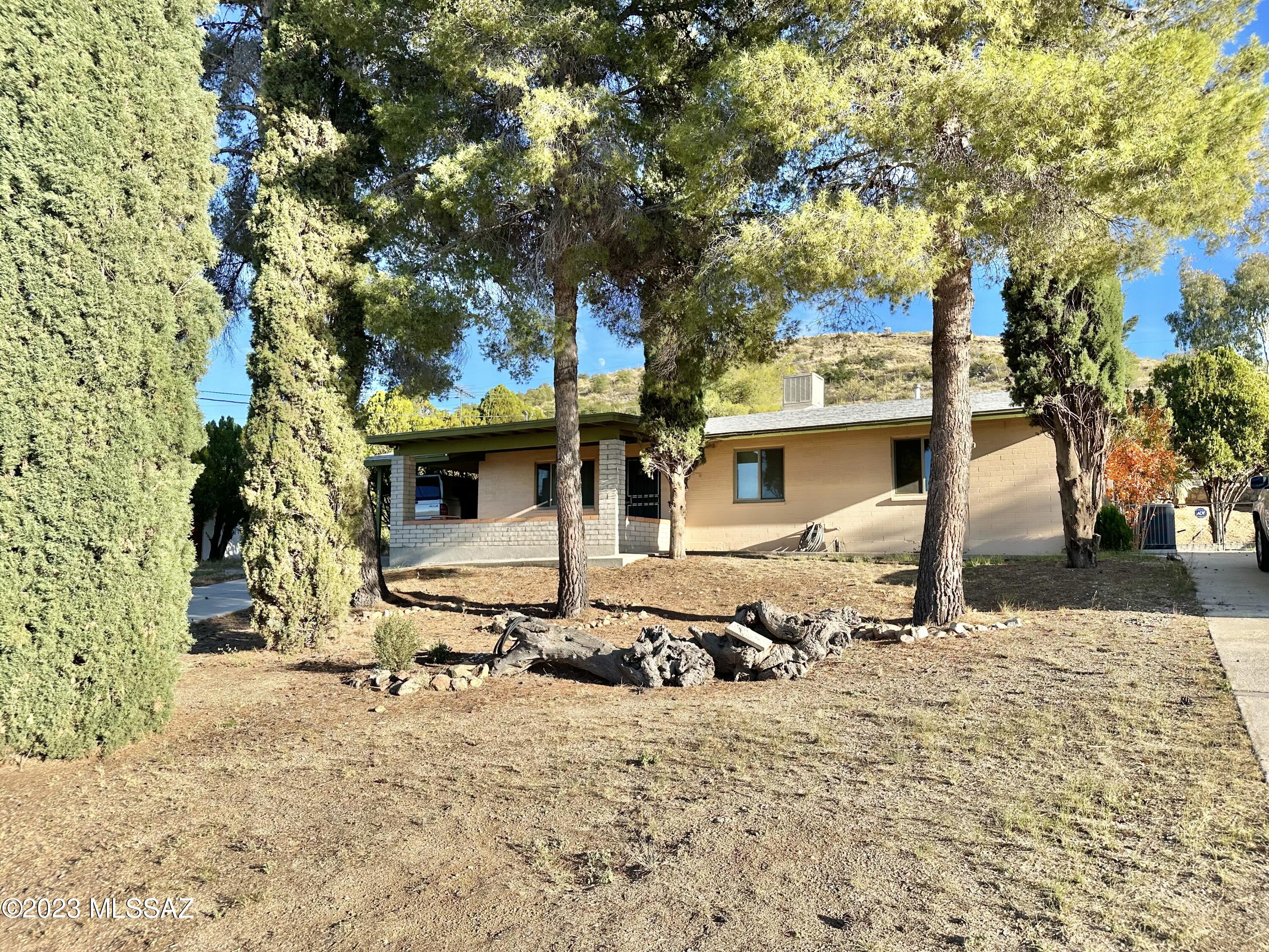 Remodeled 3-bed 2-bath home with central AC, tons of  of privacy and great mountain views! Ready for move-in today. The interior features luxury vinyl plank and tile flooring through out, updated kitchen and bathrooms, ceiling fans, and a large addition/family room. Enclosed laundry room with lots of storage space, and washer/dryer included but will not be maintained by owner. The front yard has two large driveways with tons of room for parking along with a covered porch with incredible views, while the large fenced-in backyard backs up against the hill for peace and quiet.
