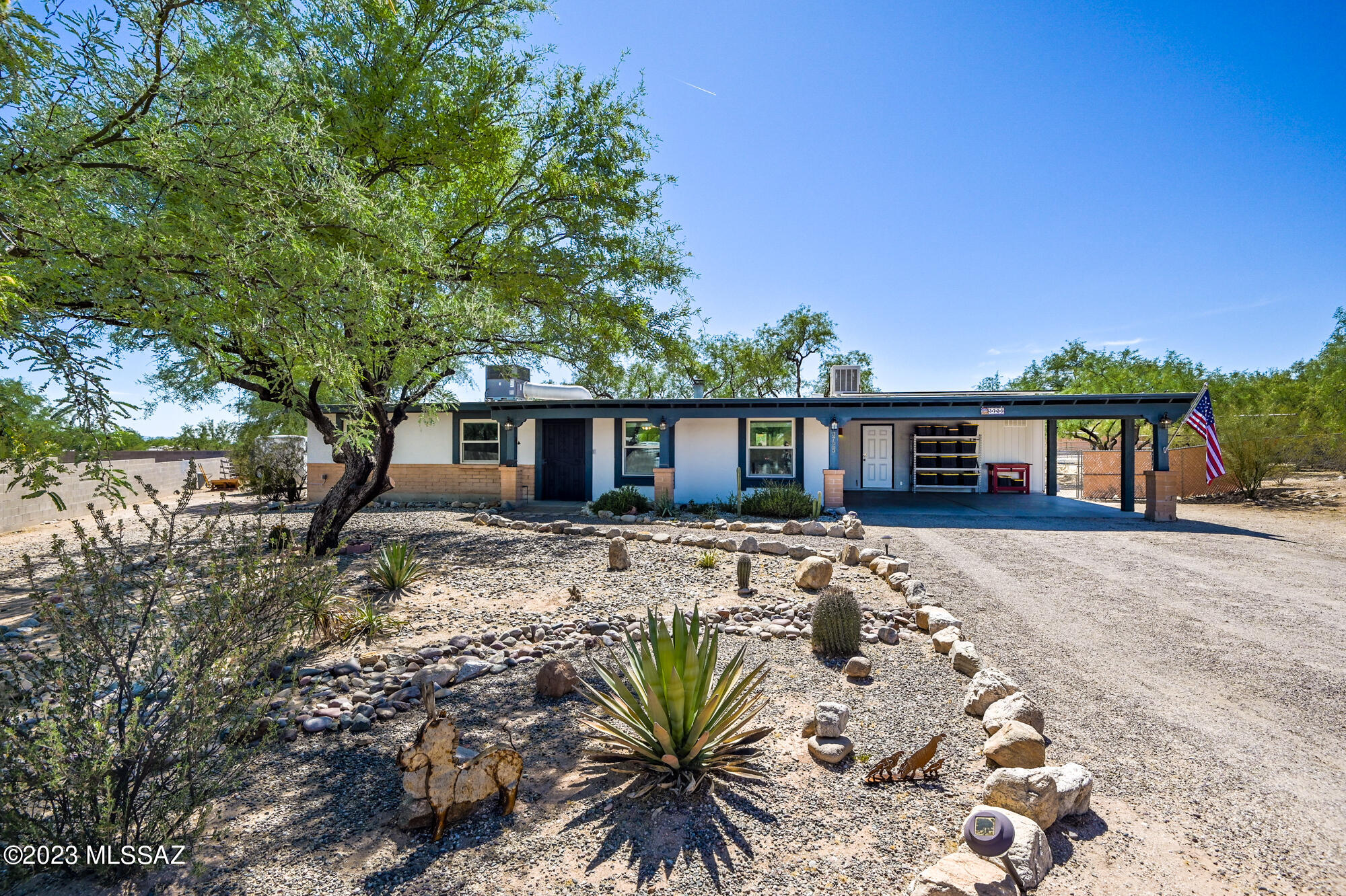 Horse lovers dream in a great neighborhood with no HOA! Private and quiet lot! Incredible Catalina Mountain views to enjoy from the back covered patio. Watch your horses in the back yard and RIDE from the property or trailer to enjoy the trails and also close to Mt. Lemmon. Move in ready, recently updated house: Chef's kitchen with brand newer high-end SS appliances, Island/Bar, plenty of cabinets/storage, and ''Silver Falls'' Granite. Double-sided wood-burning fireplace in living and family rooms for those cool desert nights. Work from home in the home office space off the workshop. Versatile horse property: Arena and two horse shelters. Brand new chicken coop, tack shed and feed shed. Even automatic waters for the horses.