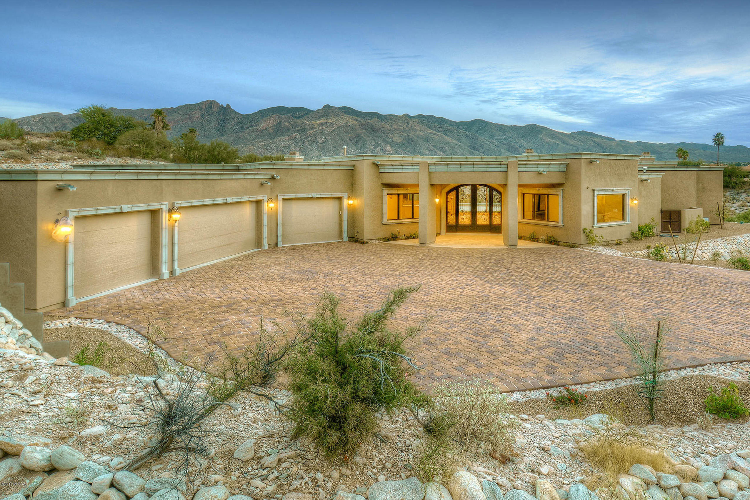 BRAND NEW STUNNING HOME ON 1.4 ACRES WITH MAJESTIC MT & CITY VIEWS IN GATED CATALINA FOOTHILLS EST. #10. WROUGHT IRON 10 FT. FRONT ENTRY DRS,EXQUISITE COMBINATION OF CANTERA STONE,GRANITE & TRAVERTINE THRU OUT,ELEGANT LIVING RM W/HIGH CEILINGS,CANTERA STONE FP,FORMAL DINING RM,GOURMET ISLAND KIT W/ALDER CABINETS,GRANITE COUNTERTOPS,TOP OF LINE STAINLESS STEEL APPL,6 BURNER GAS STOVE TOP,DBLE OVENS,2 DISHWASHERS,REFRIGE,BRKFST AREA,FAMILY RM W/FP,PELLA WINDOWS,5 BR'S(SPLIT PLAN),5 1/2 BATHS,+STUDY,MASTER W/FP,LUX.BATH W/GRANITE & TRAVERTINE, JACUZZI TUB,SHOWER,LG WALK IN CLOSET & ENTRY TO PATIO.LG BKYD W/COV’D PATIO, POOL,SPA,GRASS,4 CAR GAR,BRICK PAVER DRIVEWAY,DIST 16 SCHLS.BREATHTAKING MTN & CITY VIEWS.FLR PLN AND DRONE UNDER PHOTOS.ONE SELLER IS LICENSED REALTOR IN STATE OF ARIZONA.