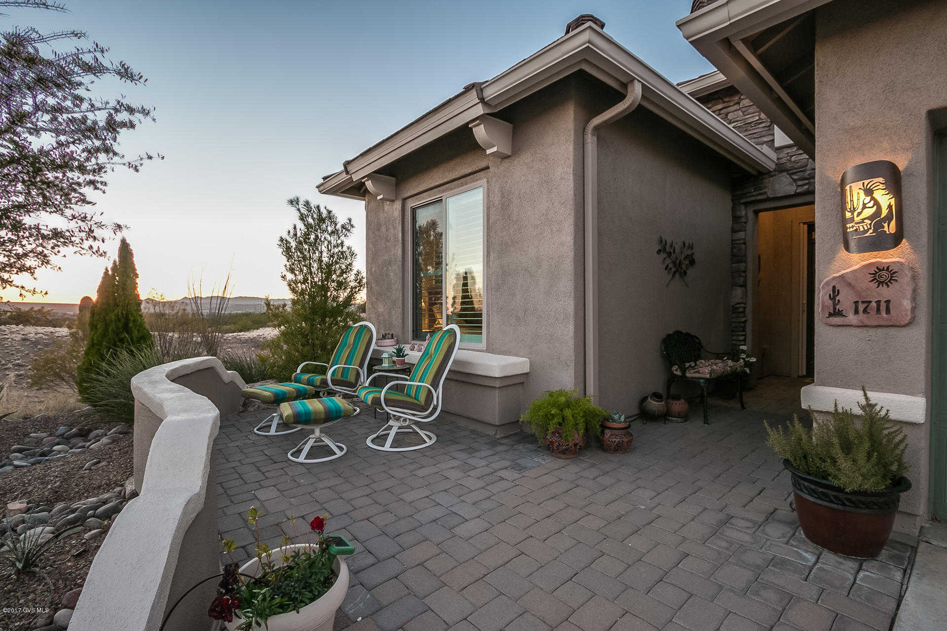Spectacular Desert, Mountain and Sunset views from this elegant & expanded Newport Model. Features include an inviting foyer, open floor plan w/designer kitchen, stainless appliances, walk-in pantry, great room w/bamboo flooring, gas fireplace & custom built-in cabinetry, spacious master suite, den, pv solar system, and extended 2.5 car garage w/loads of cabinets & workshop space. The outdoor spaces offer a front courtyard & a large rear patio w/ramada, built-in grill & eating bar plus electric solar shades. This home is sited for privacy and views. Make this #1 on your must see list!