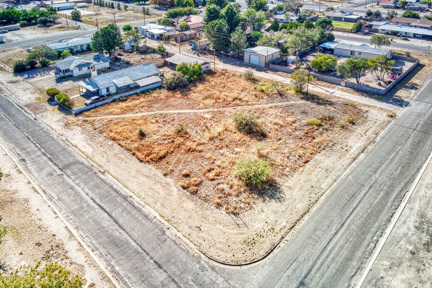 Large Corner Lot  in the middle of town surrounded by homes. Three city lots, could be split. Zoned Residential.