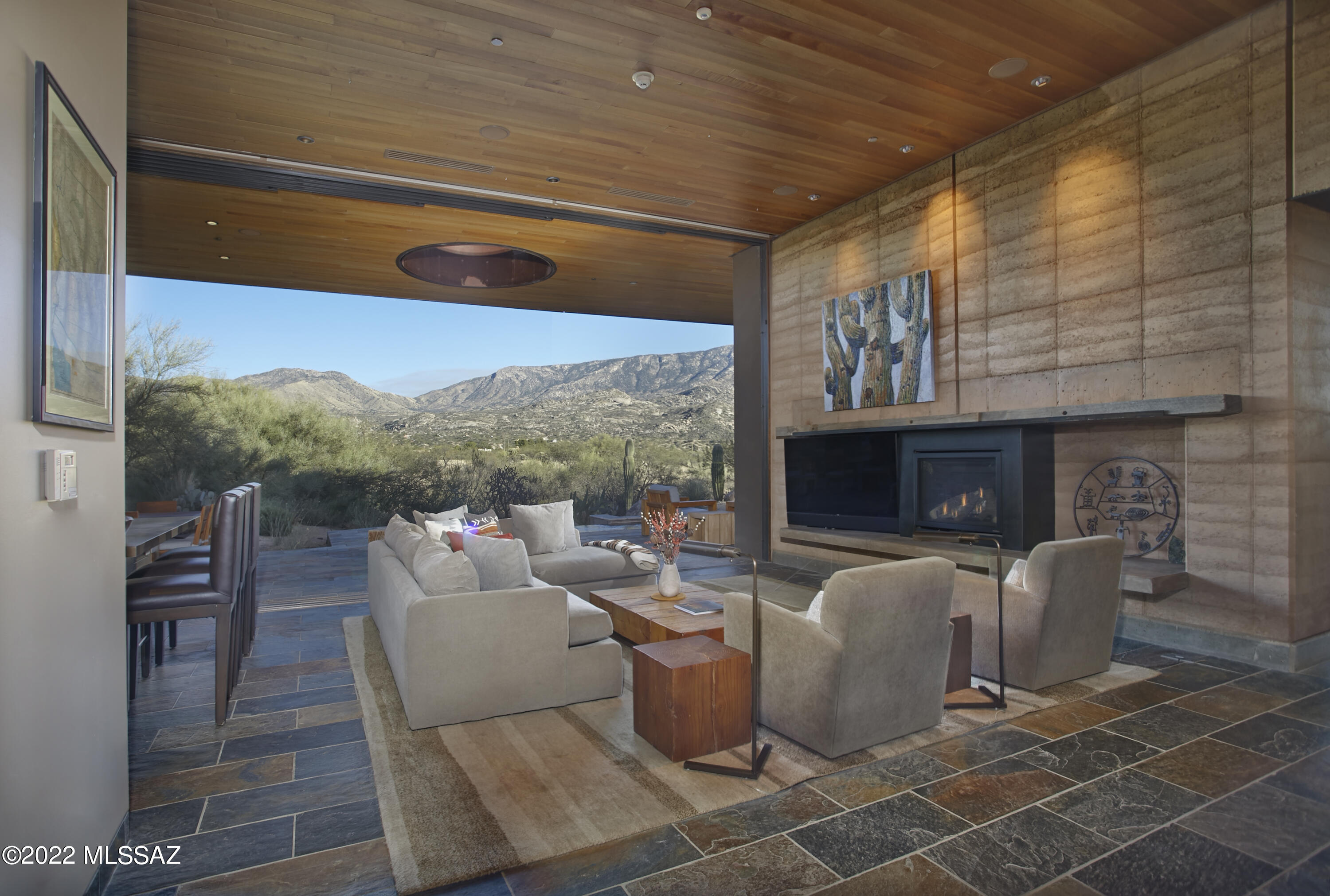 Welcome to your private wellness sanctuary, tucked away in a small enclave of homes on the grounds of MIRAVAL Resort in Tucson, AZ.  This residence and this lifestyle are distinctly different.  Here, you hit the pause button and recharge.  With the amenities of a world class destination spa at your doorstep, it's easy to do. Created by the forward-thinking minds at MITHUN of Seattle, this home intentionally feels subdued from the approach, while offering a powerful experience upon entering.  Blending with the earth and honoring the desert were top of mind for a sustainable build.  Awarded Silver LEED status from the Green Building Council, the property integrates materials, textures and colors that speak to the surrounding landscape. Seamlessly blending indoors and out, with unobstructed views of the Catalina Mountains, this setting invites you to relax, breathe and connect with nature.  Layers of the desert unveil themselves as light moves throughout the day.  This is truly a place that allows the mind to clear and opens space for creative thoughts.

A thoughtful layout offers the ability to comfortably host guests or delineate spaces for different functions.  The 2400 sq ft main house includes the primary suite, guest bedroom, guest bath and great room flowing to an expansive patio from which you feel completely secluded.  With a gas fire pit, infinity plunge pool with swim jets and outdoor daybed, this area adds substantial living space to the home.  A 700 sq ft detached casita provides a private setting for guests with separate living and rest spaces, ensuite bath and courtyard with a jetted spa.

Homeowners and their guests may choose to immerse themselves in the experiences at MIRAVAL as little or as much as they desire.  The resort has created an environment in which a wellness journey is completely individual and offers a robust variety of facilities, services, and activities.  A sampling of offerings includes spa treatments, fitness classes, yoga, meditation, hiking, mountain biking, equine therapy and horseback riding, lectures, culinary classes, and spiritual sessions.  With on-site dining, concierge and transportation services, everything needed is at your fingertips.

A unique and easy to own asset, this property would work beautifully as a vacation home, seasonal residence, or corporate retreat.  There is the option to rent the property through the resort-managed rental program when unoccupied, if desired.