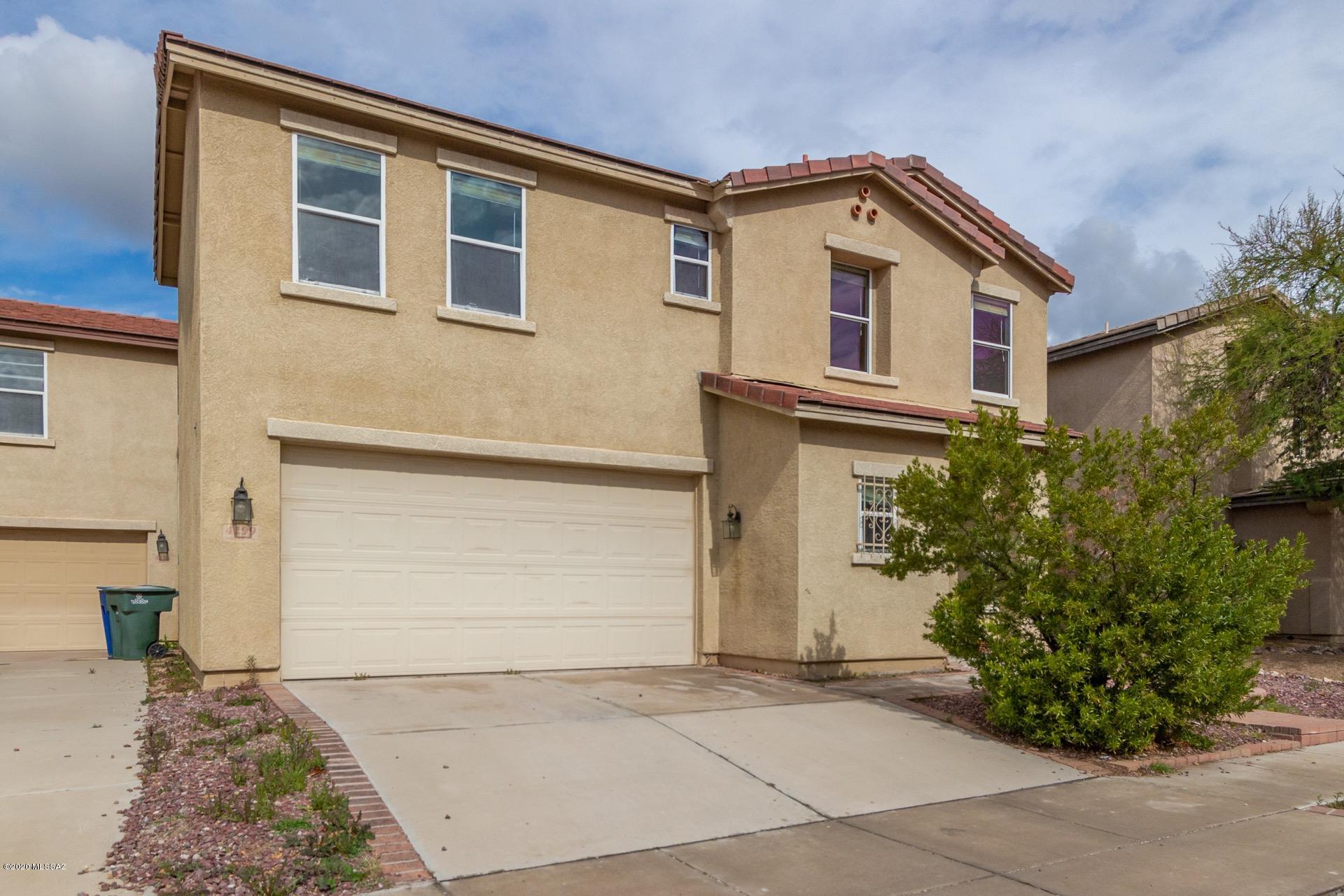 Dont miss this incredible 2 story, 3 bedroom plus a den  /2.5 bathroom home in the heart of Tucson. Excellent centrally located community, near cafes, parks, shopping, restaurants and within easy reach of downtown and the UofA. Impressive interior is open and bright. Ideal floor-plan offers separate living and family rooms and an open concept kitchen with a pantry and plenty of cabinet and counter space. Beautiful and easy to care for wood look and tile flooring throughout. Upstairs is a large loft, perfect for use as a media or play area. Master retreat includes a walk in closet and private en-suite. The secluded, low maintenance backyard is surrounded by block fencing and includes a large covered patio, a perfect spot to relax or entertain. Close to major shopping & entertainment.