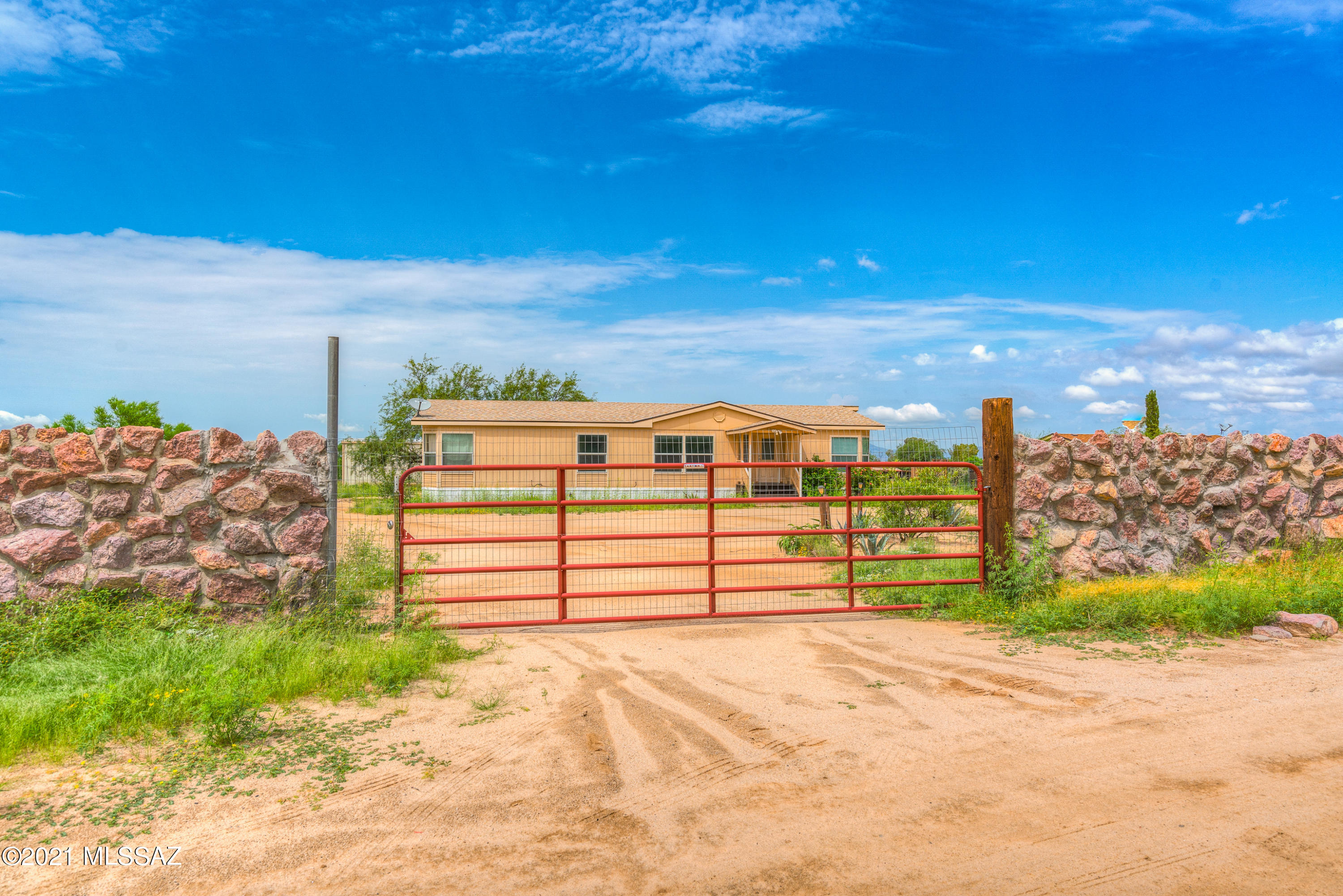 Slightly under an acre, this home offers tons of space for a growing family or someone with a lot of hobbies. Kitchen cabinets were recently painted and new counters were installed. Bedrooms are very big with spacious closets. Open concept living room with plenty of windows for lighting. There is a very large workshop powered with outlets for a garage or projects. Short dirt road drive from main road with a market close by. Hurry, show and sell!!